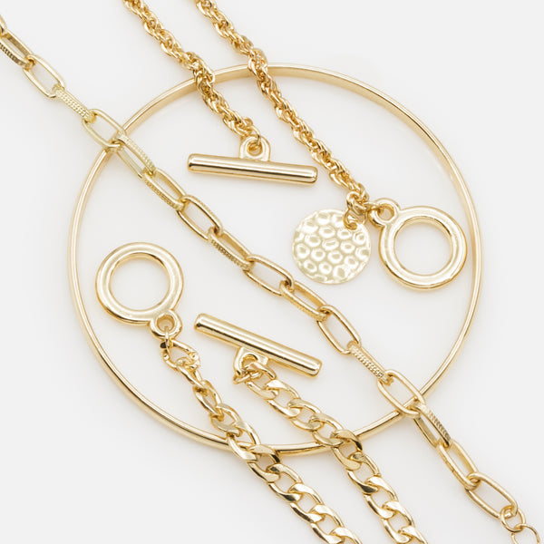 Load image into Gallery viewer, Rigid bracelet set and trio of gold bracelets with varied links