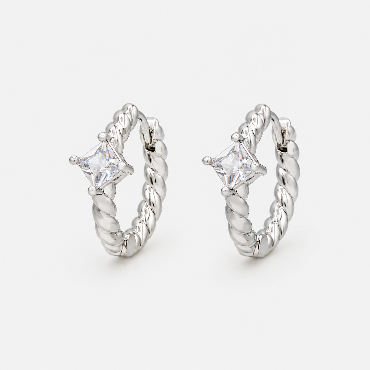 Silver twisted huggie earrings with translucent stone