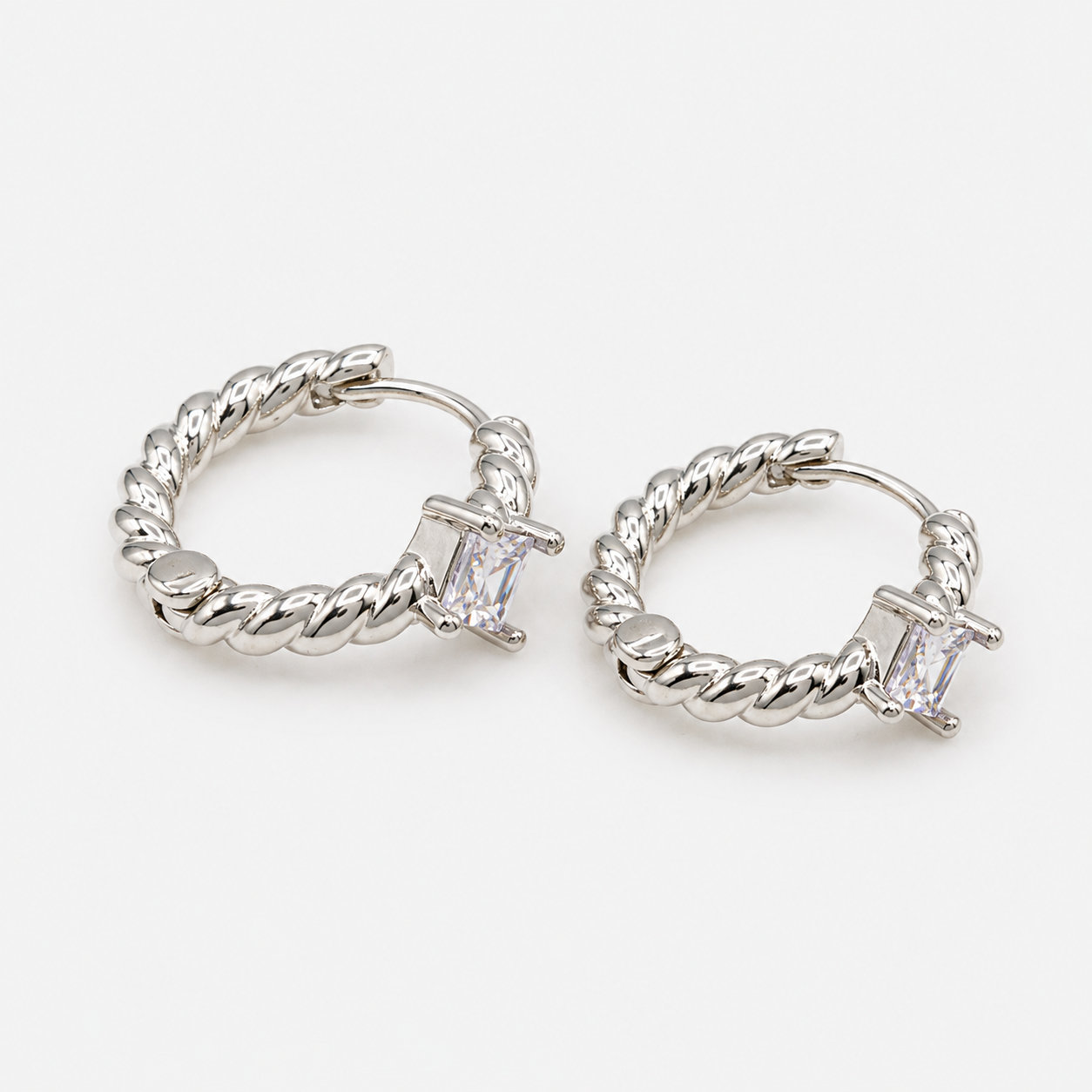 Silver twisted huggie earrings with translucent stone