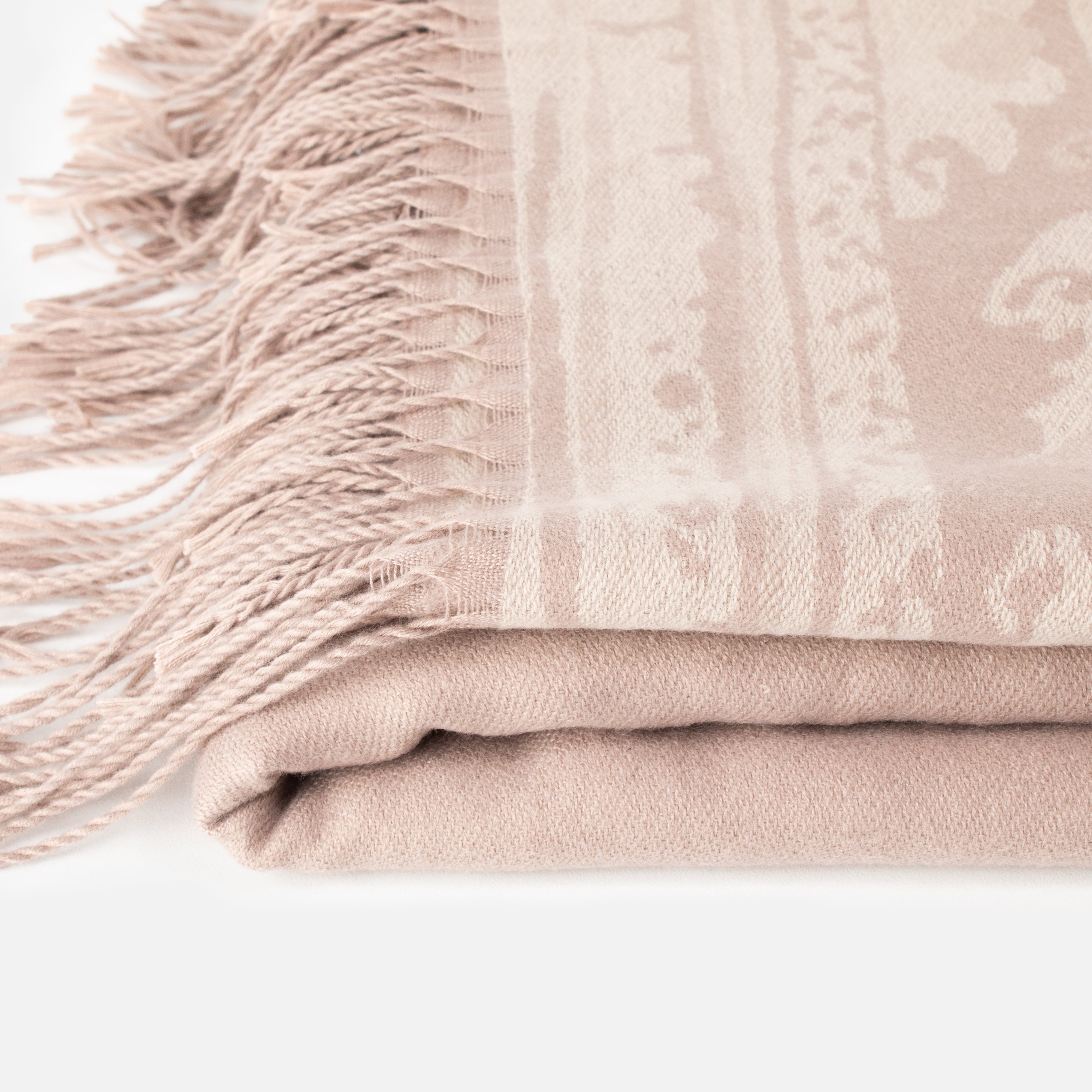 Poncho beige avec motif et frange