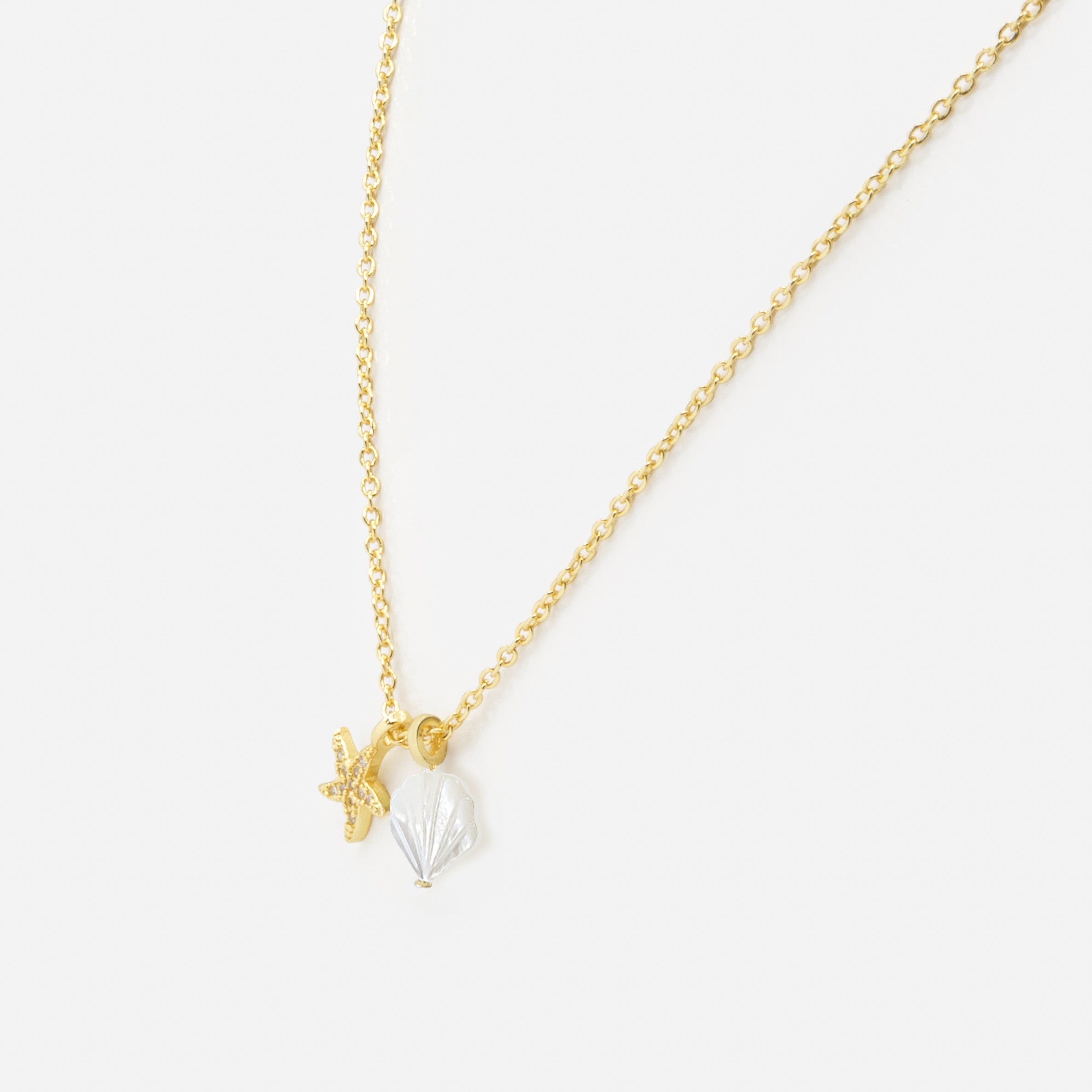 Gold necklace with shell and starfish charms