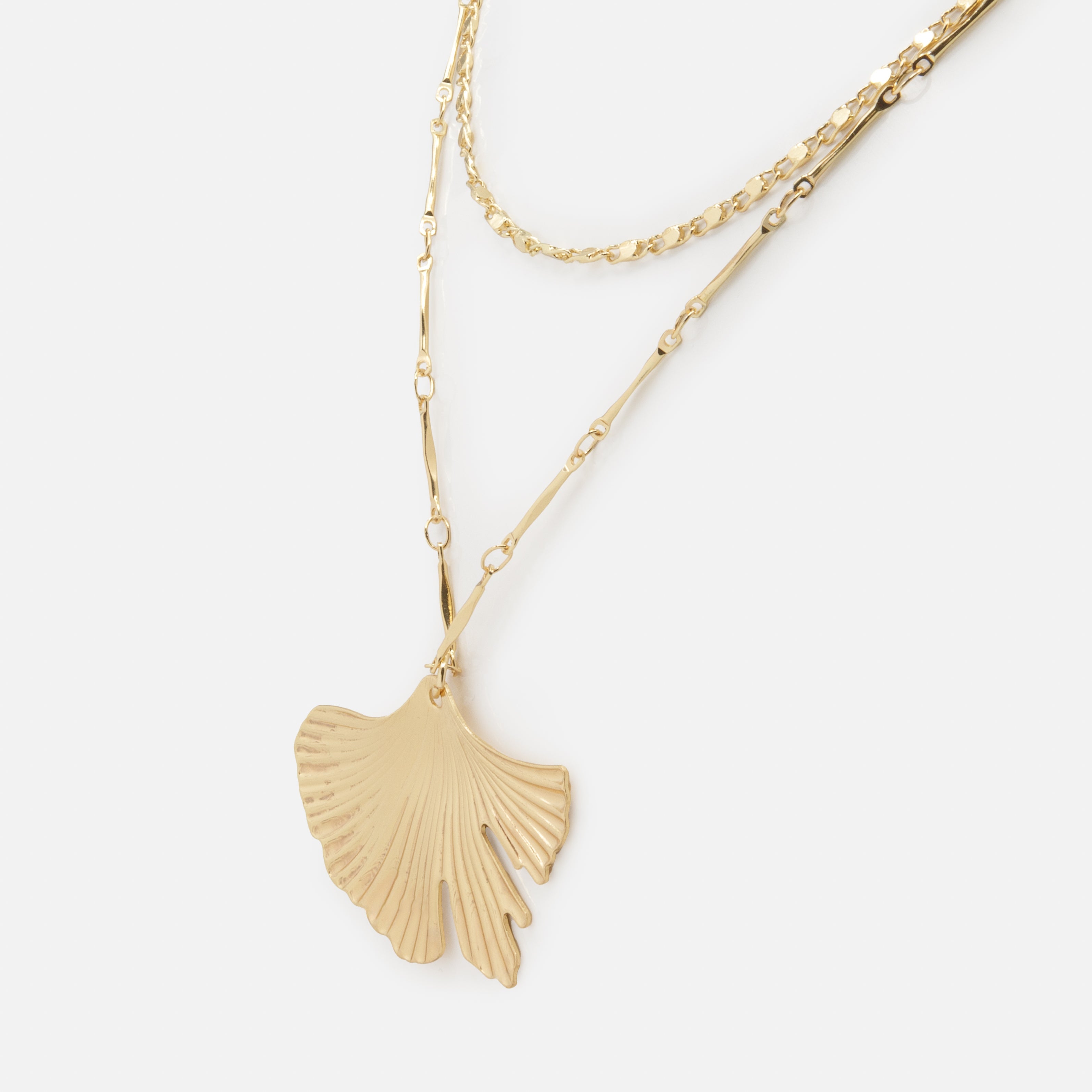 Gold double chain necklace with coral pendant