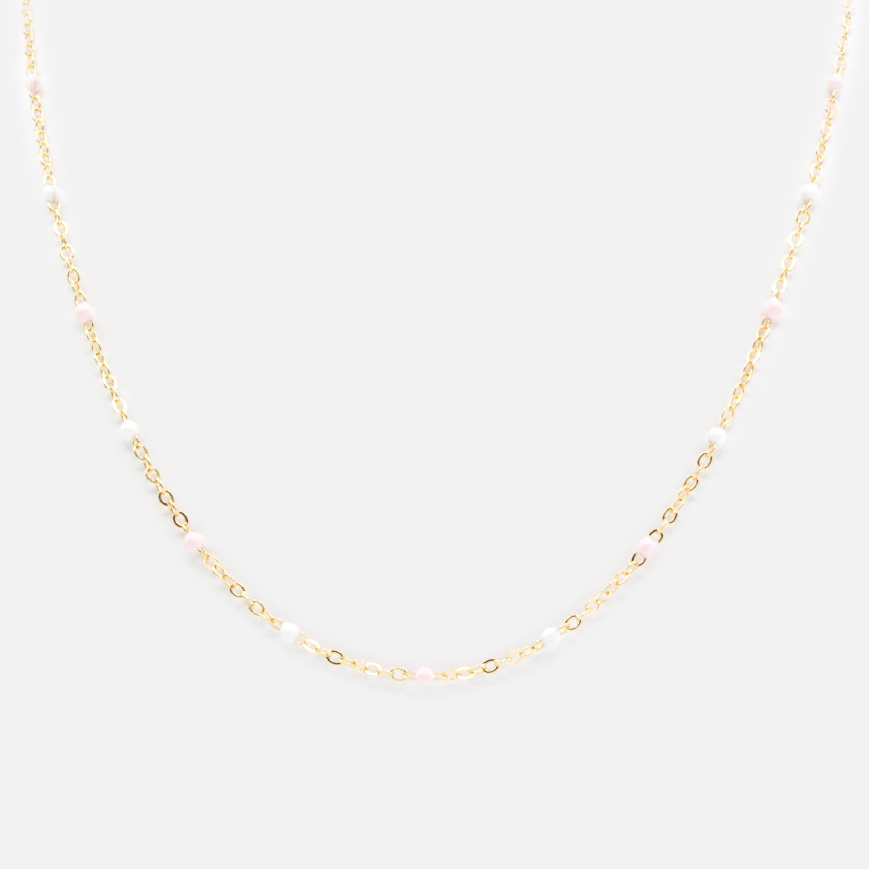Collier doré avec billes roses et blanches