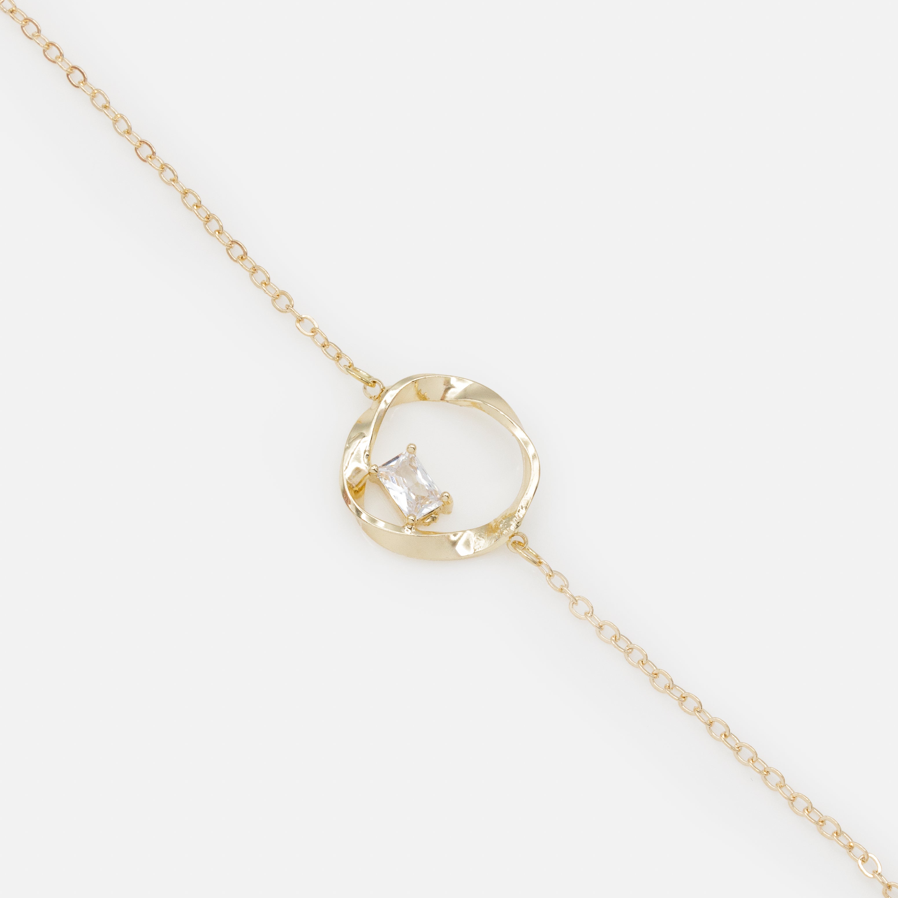 Gold twisted circle bracelet with translucent stone