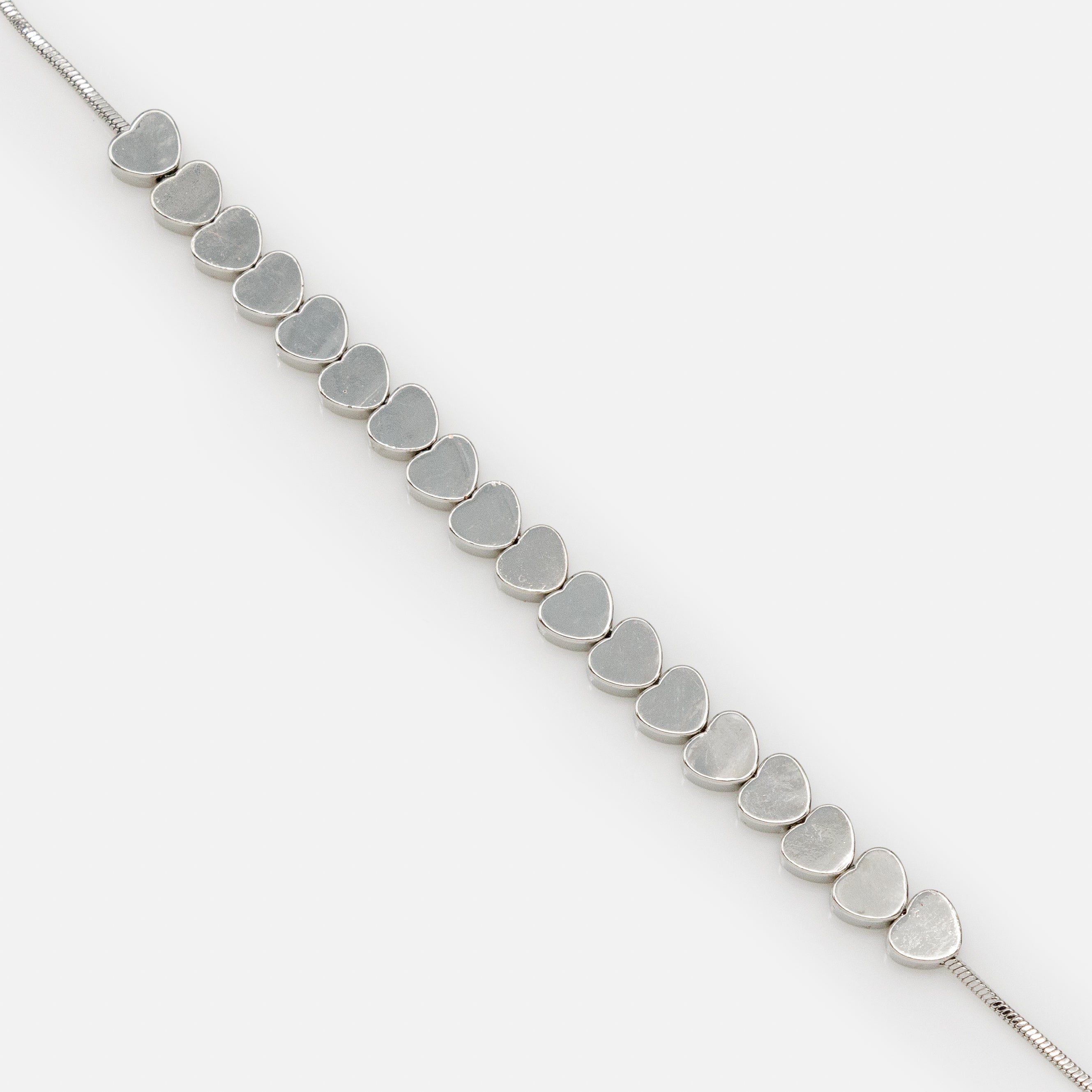 Adjustable silver bracelet with a series of flat hearts