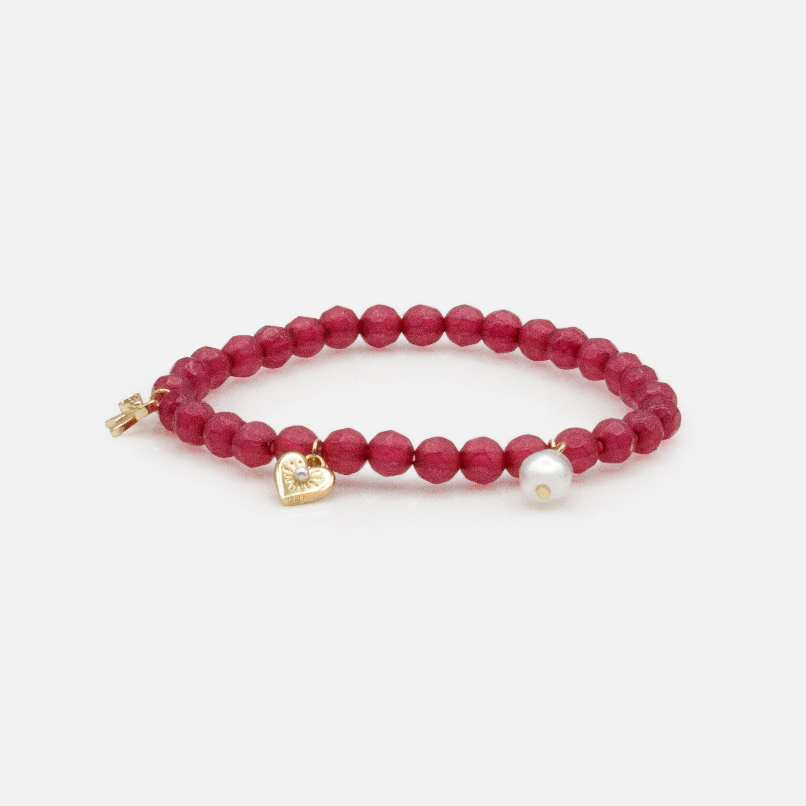 Dark pink elastic beaded bracelet with trio of charms