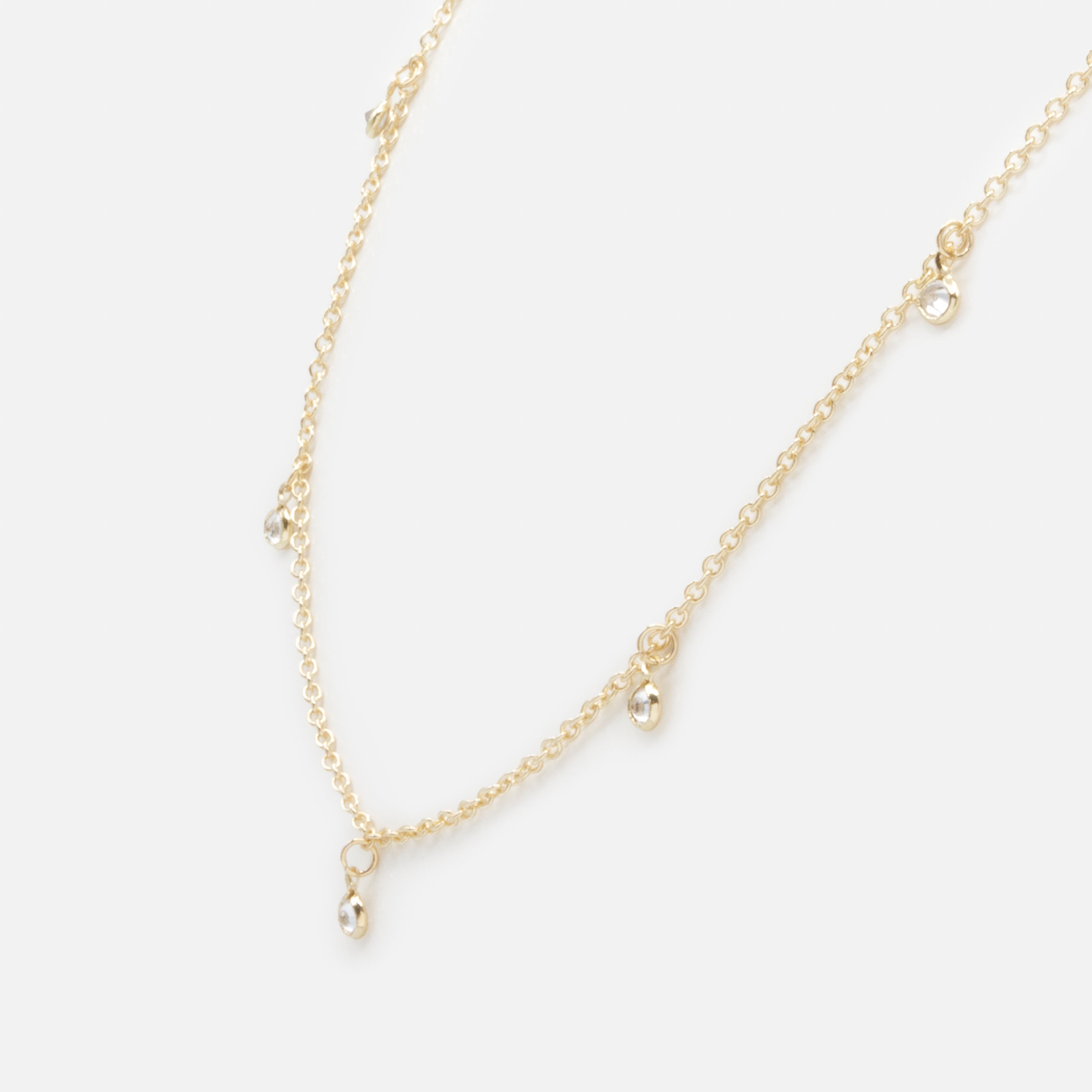 Collier doré petites breloques rondes avec zircons cubiques