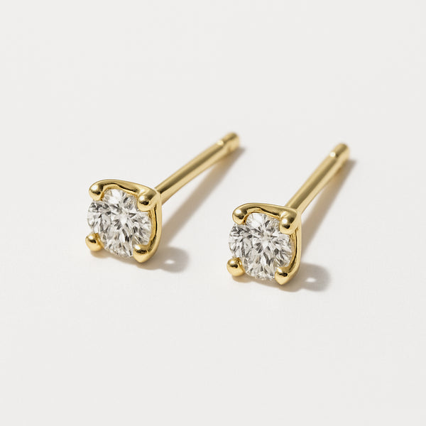 Load image into Gallery viewer, Earrings set with a 2.5 mm round cubic zirconia on 14k gold posts