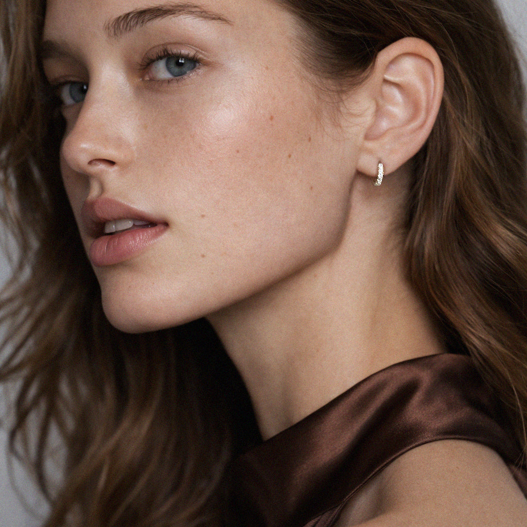 10k gold huggies earrings with cubic zirconia