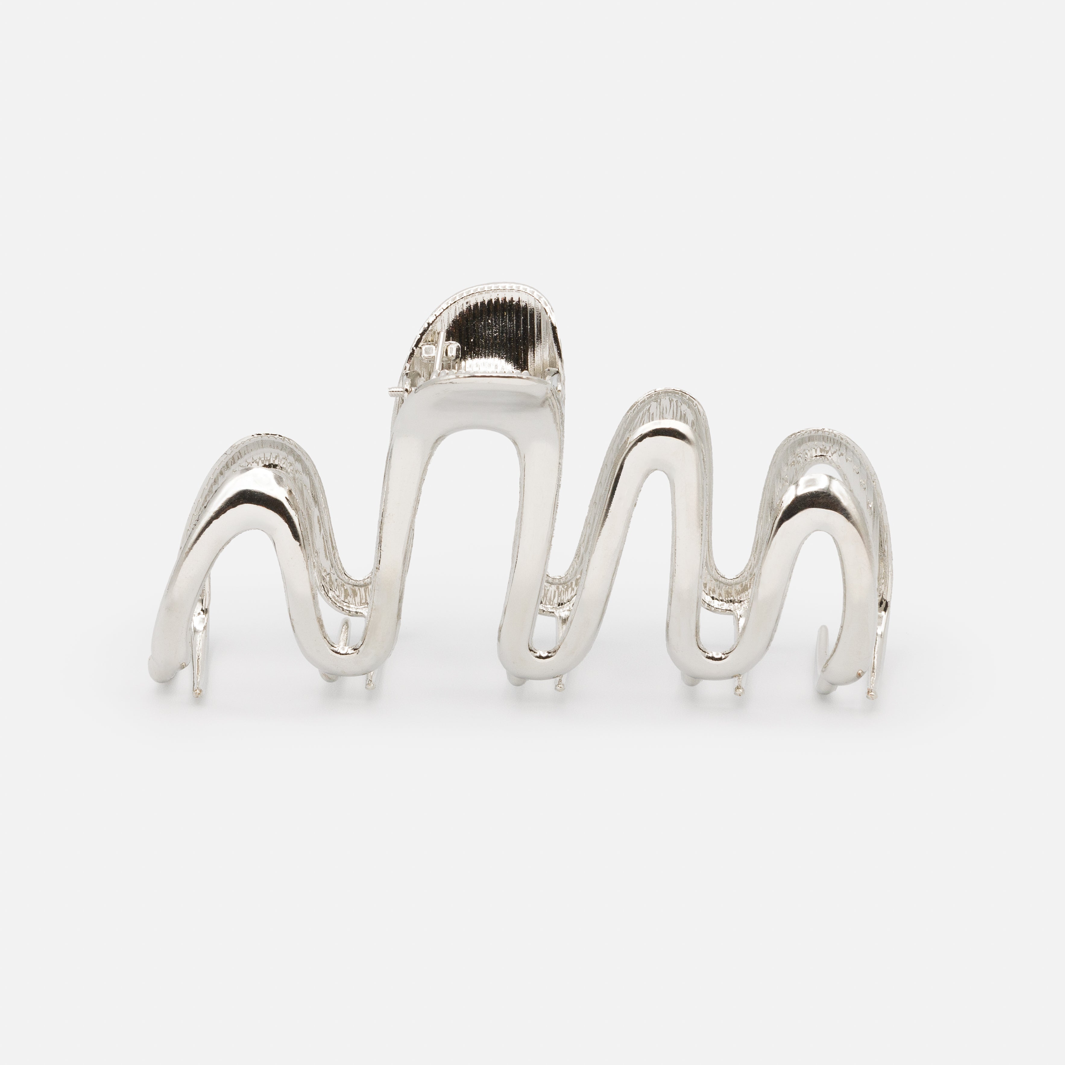 Very large silver clip with sinuous legs