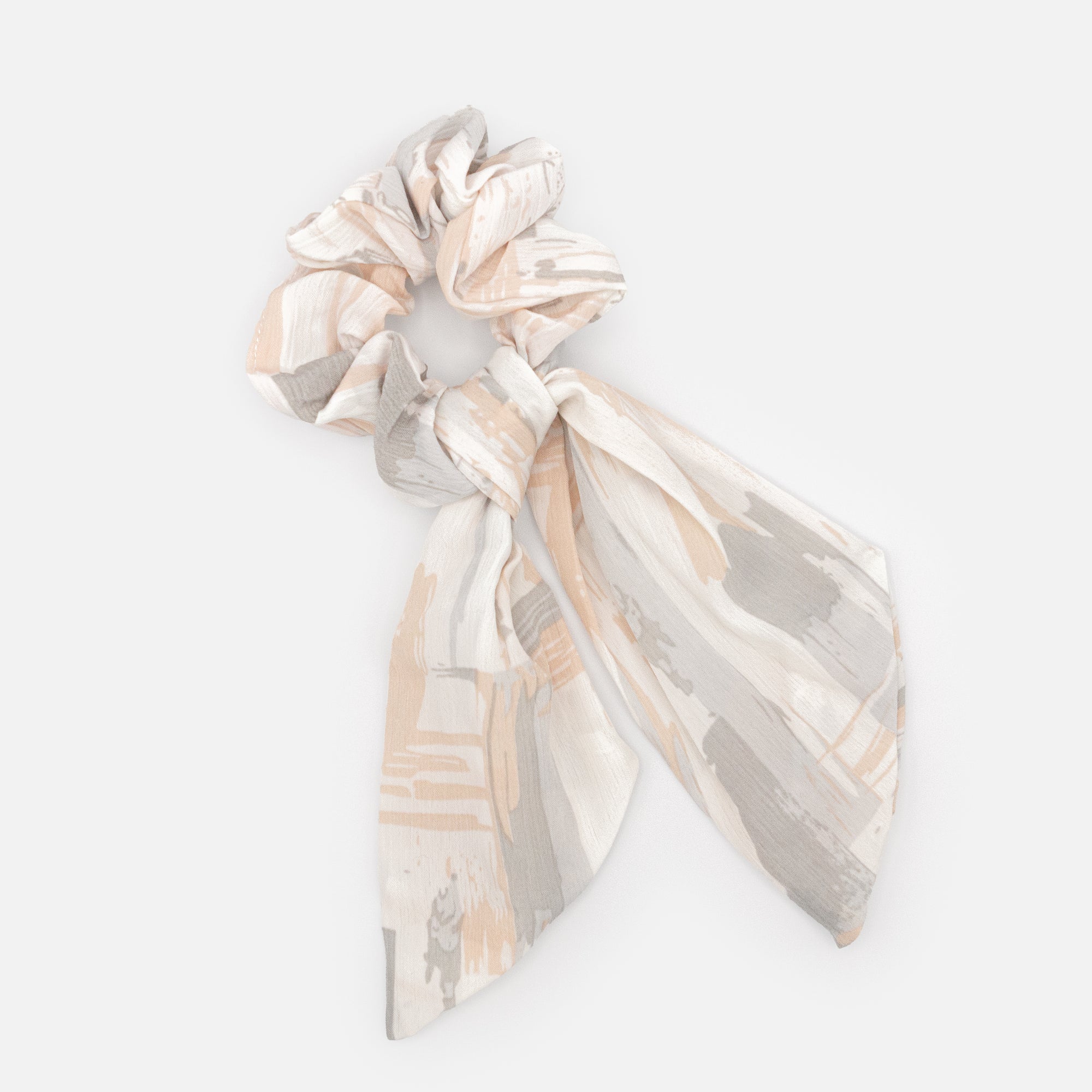 White bow scrunchie with gray and peach spots