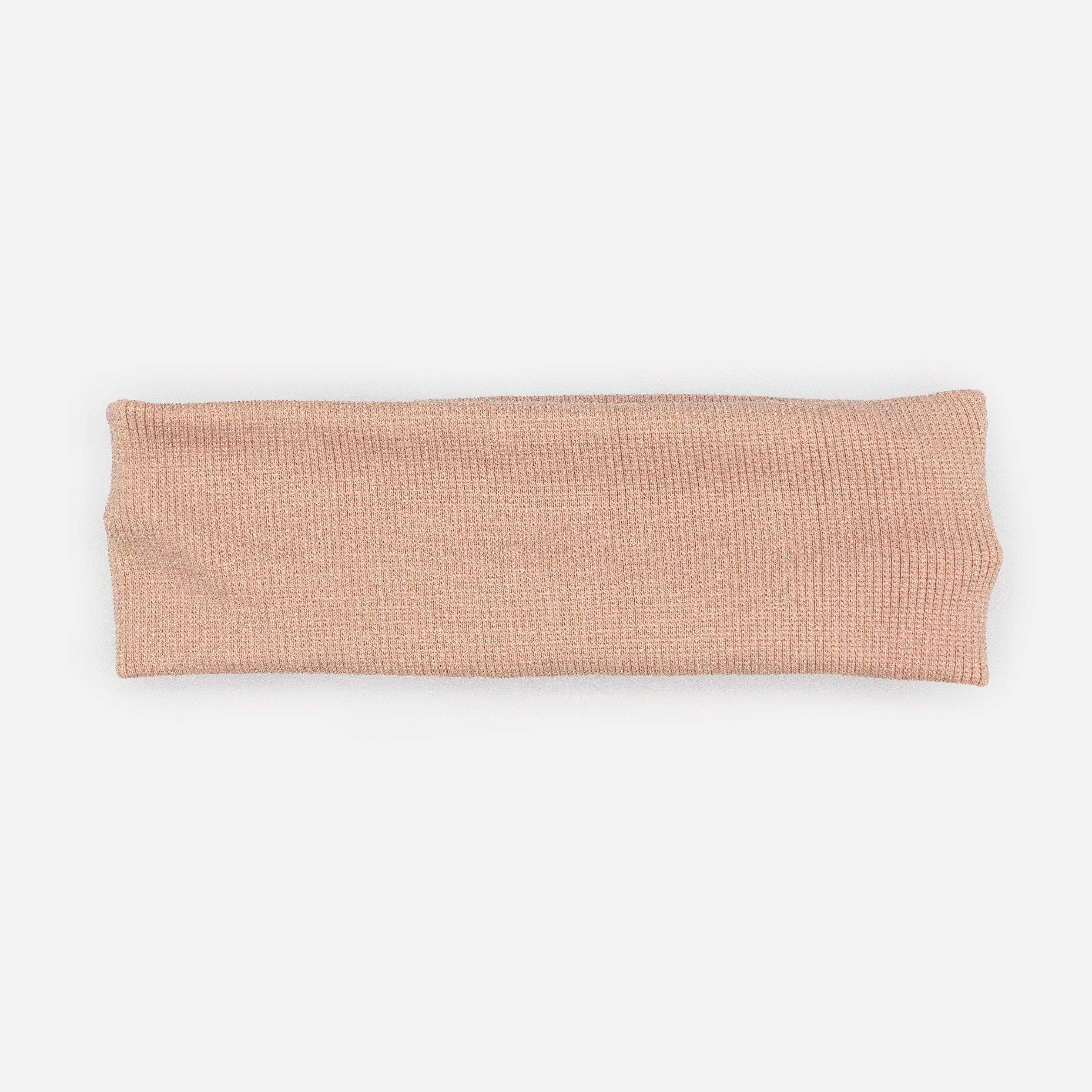 Old pink headband in ribbed fabric
