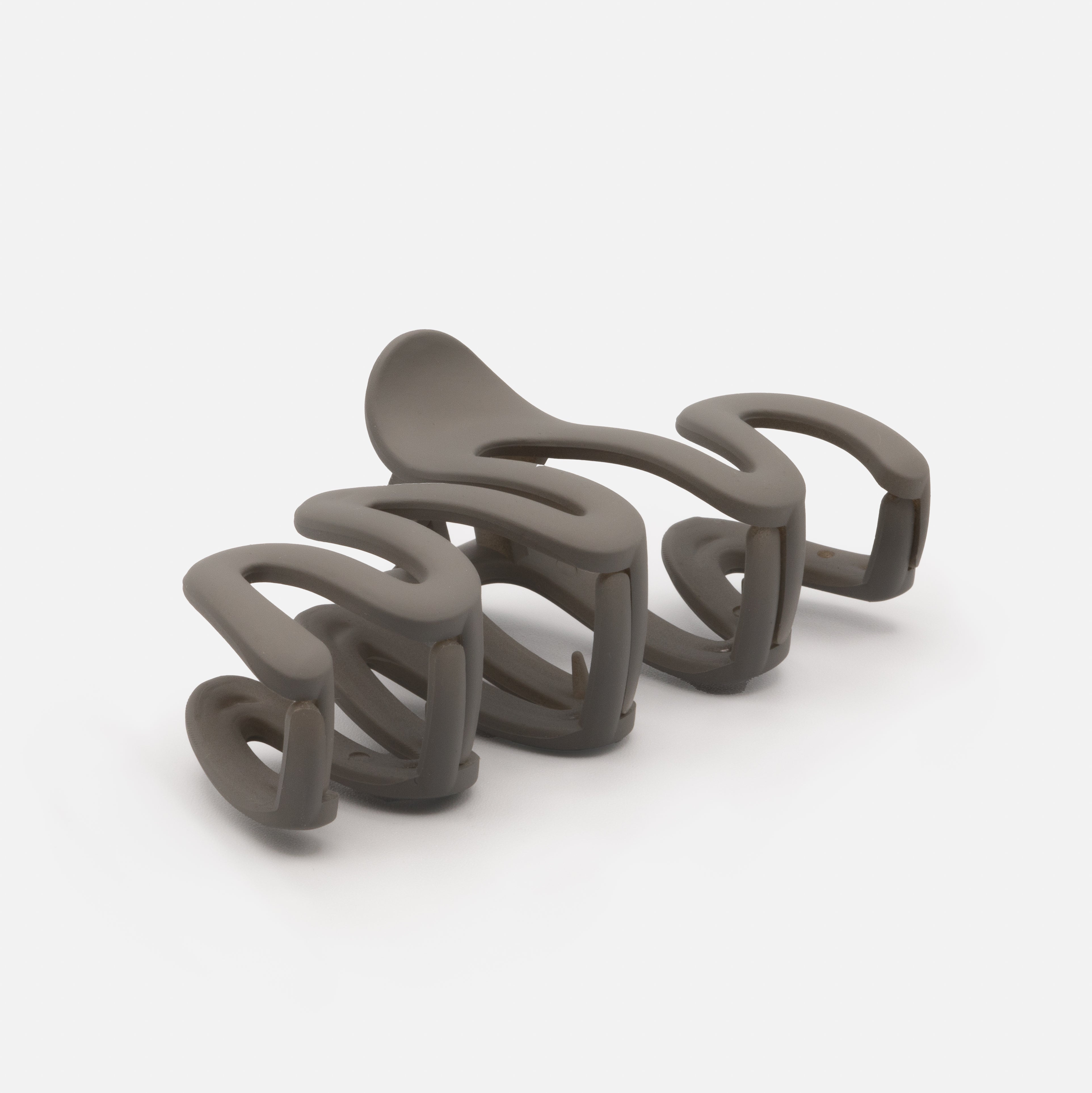 Dark gray wavy plastic clip with matte finish