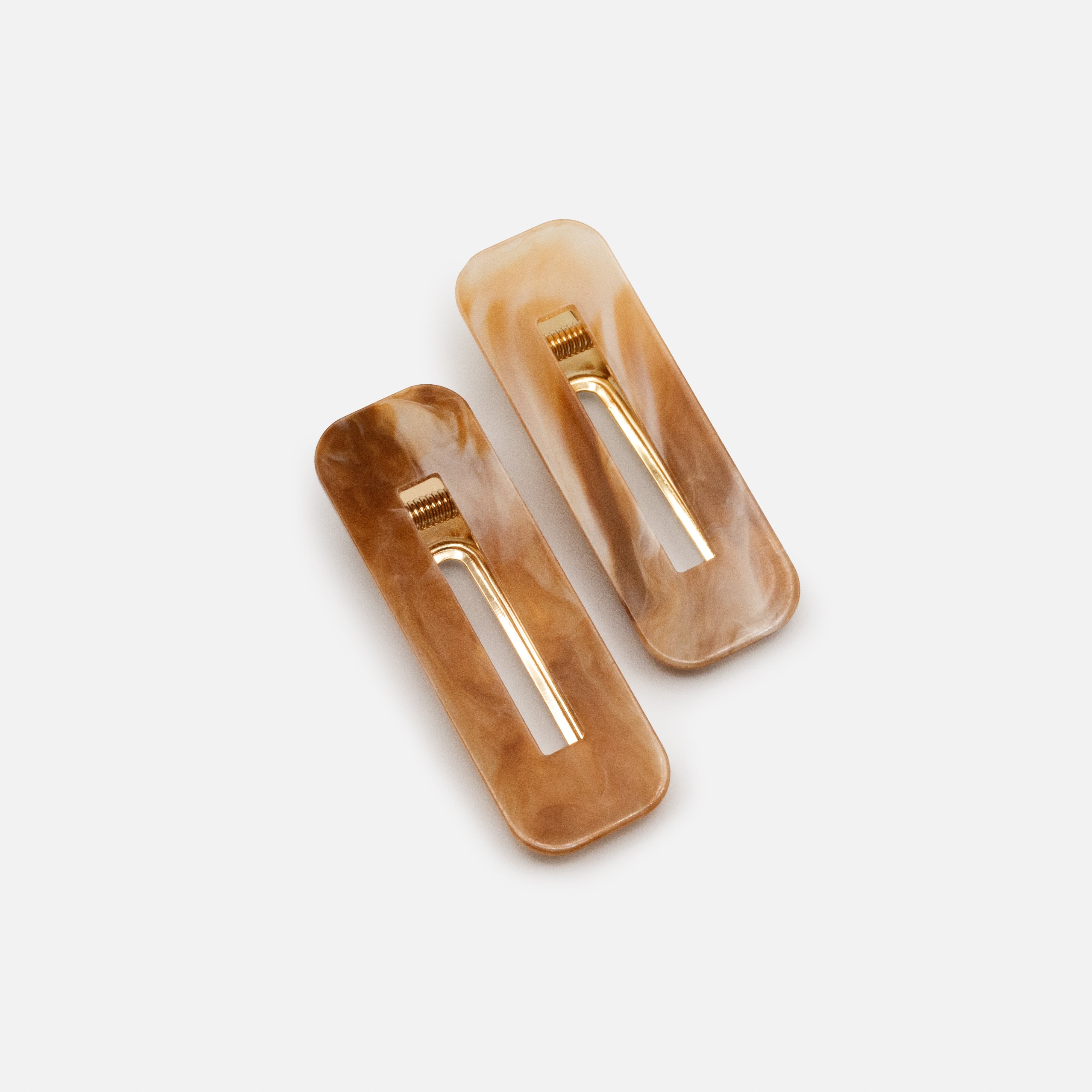 Duo of ivory & caramel marbled plastic clips