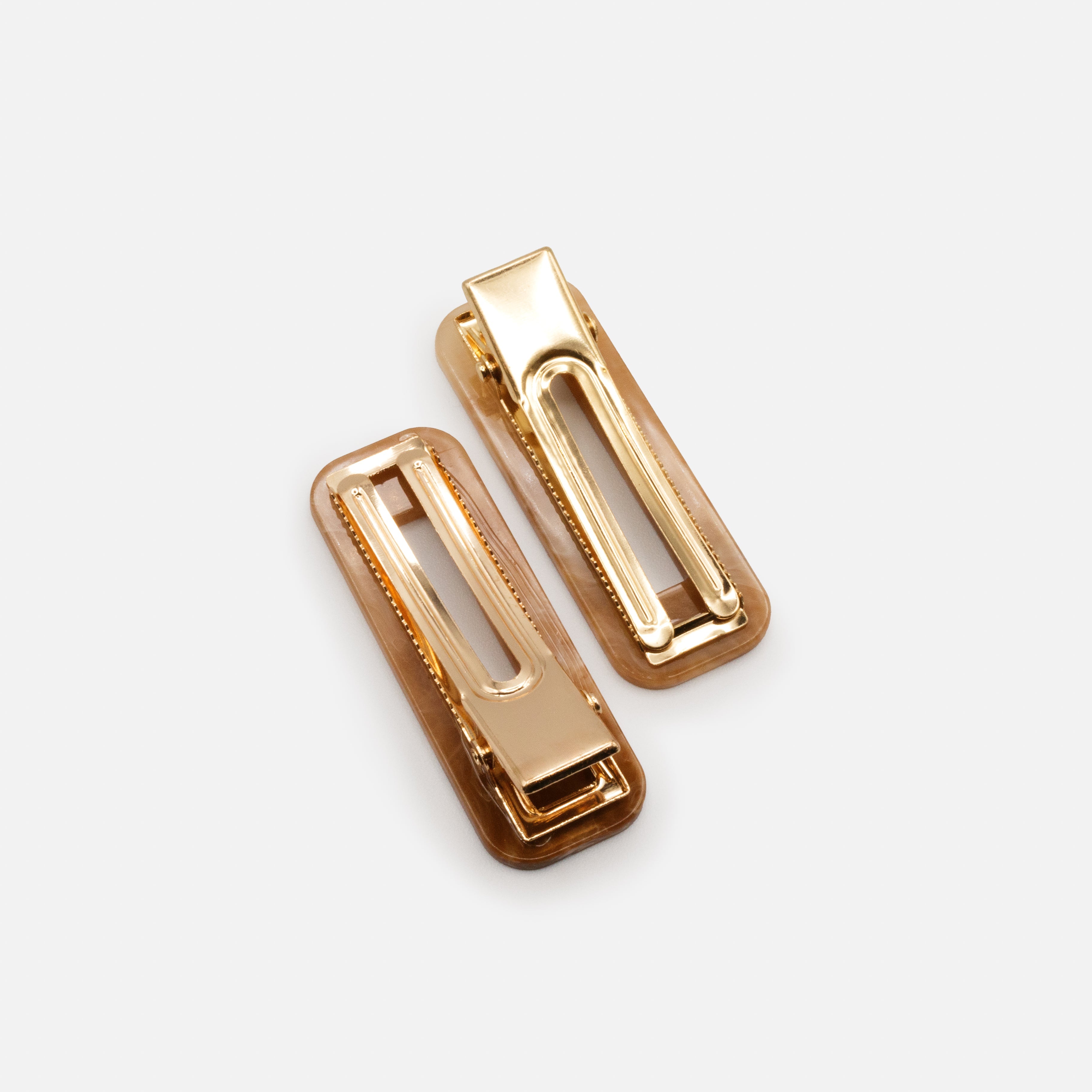 Duo of ivory & caramel marbled plastic clips