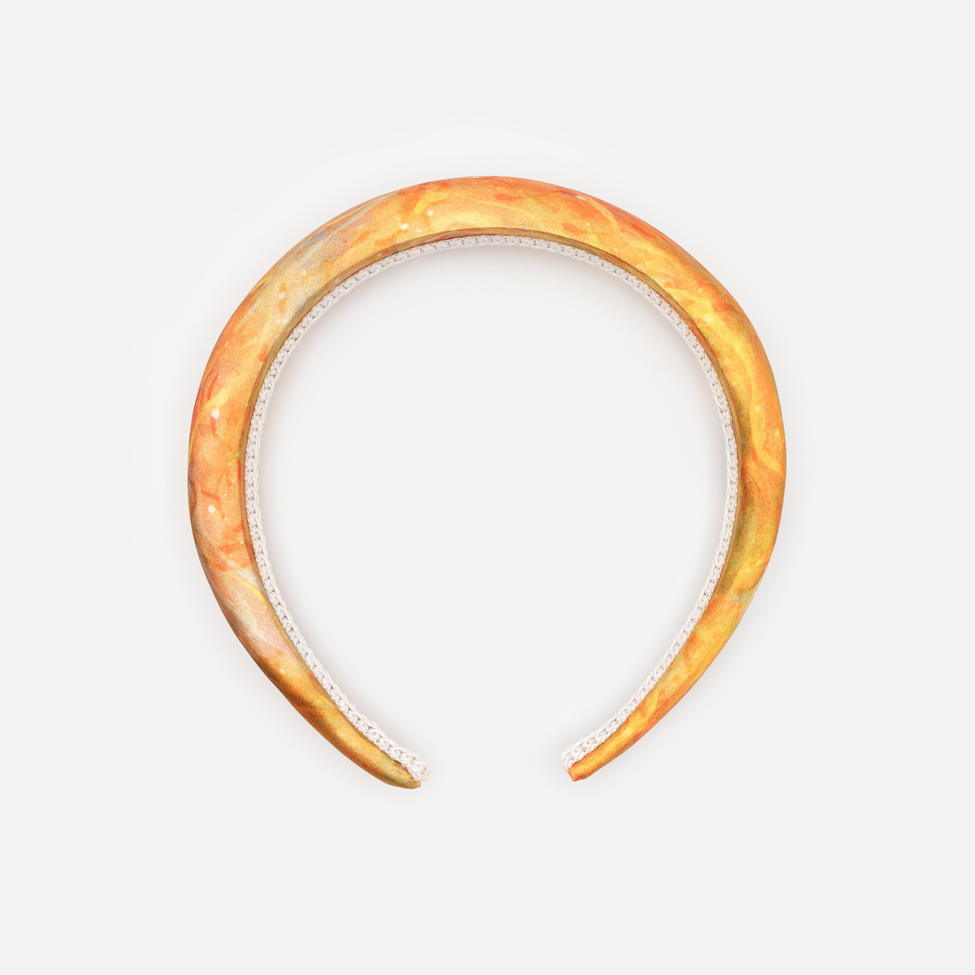 Padded headband in orange tones