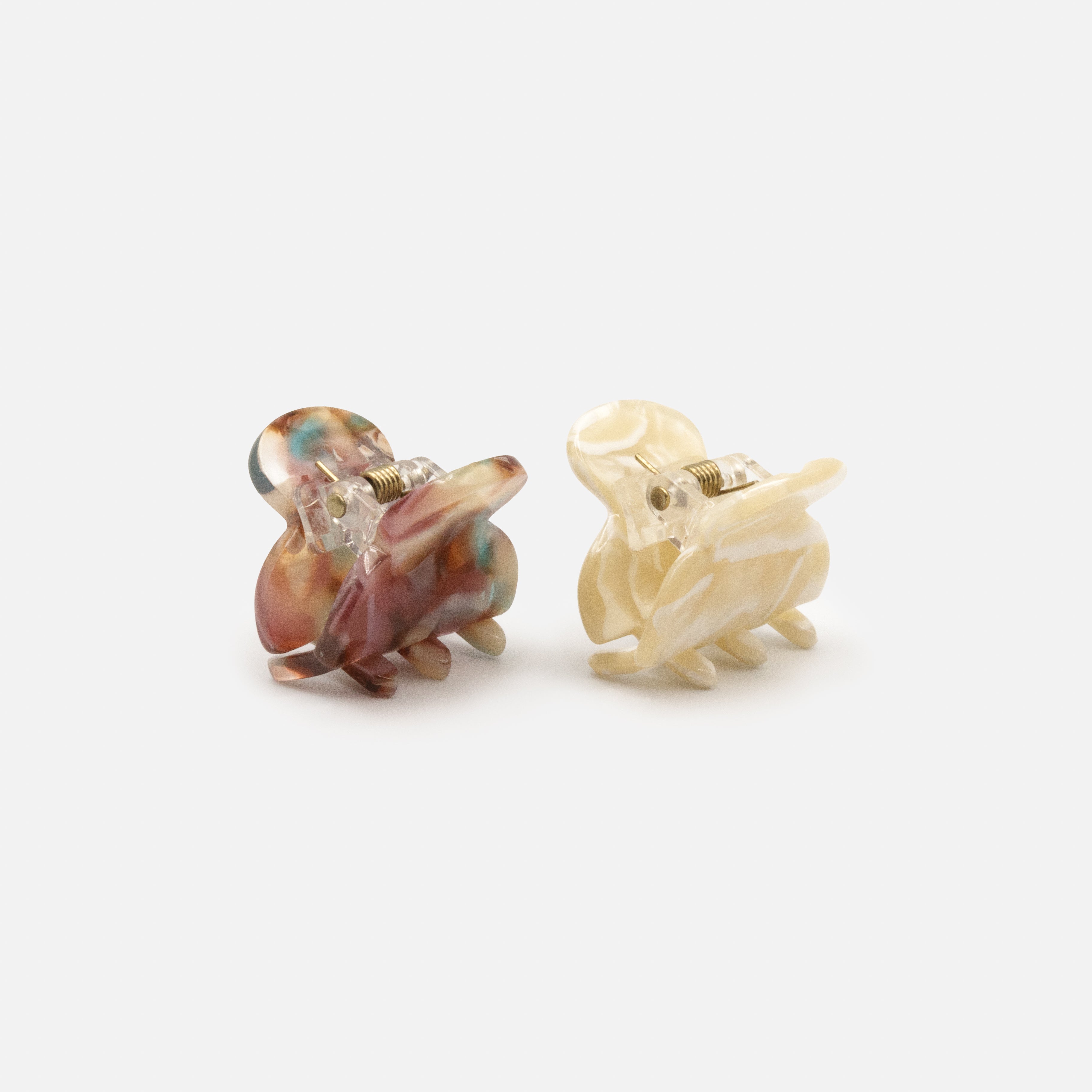 Duo of small ivory & burgundy marbled plastic clips