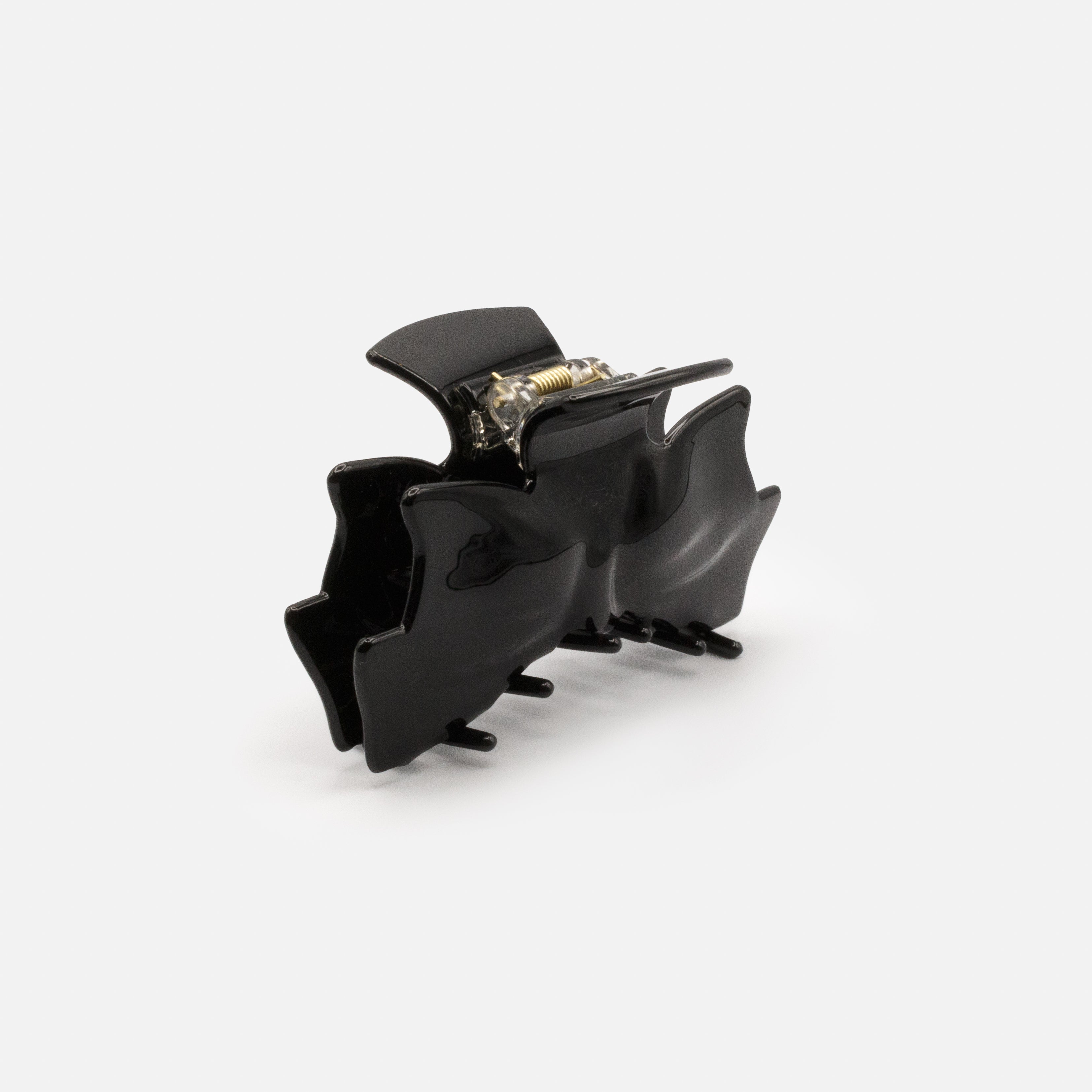 Black plastic loop clip with a glossy finish