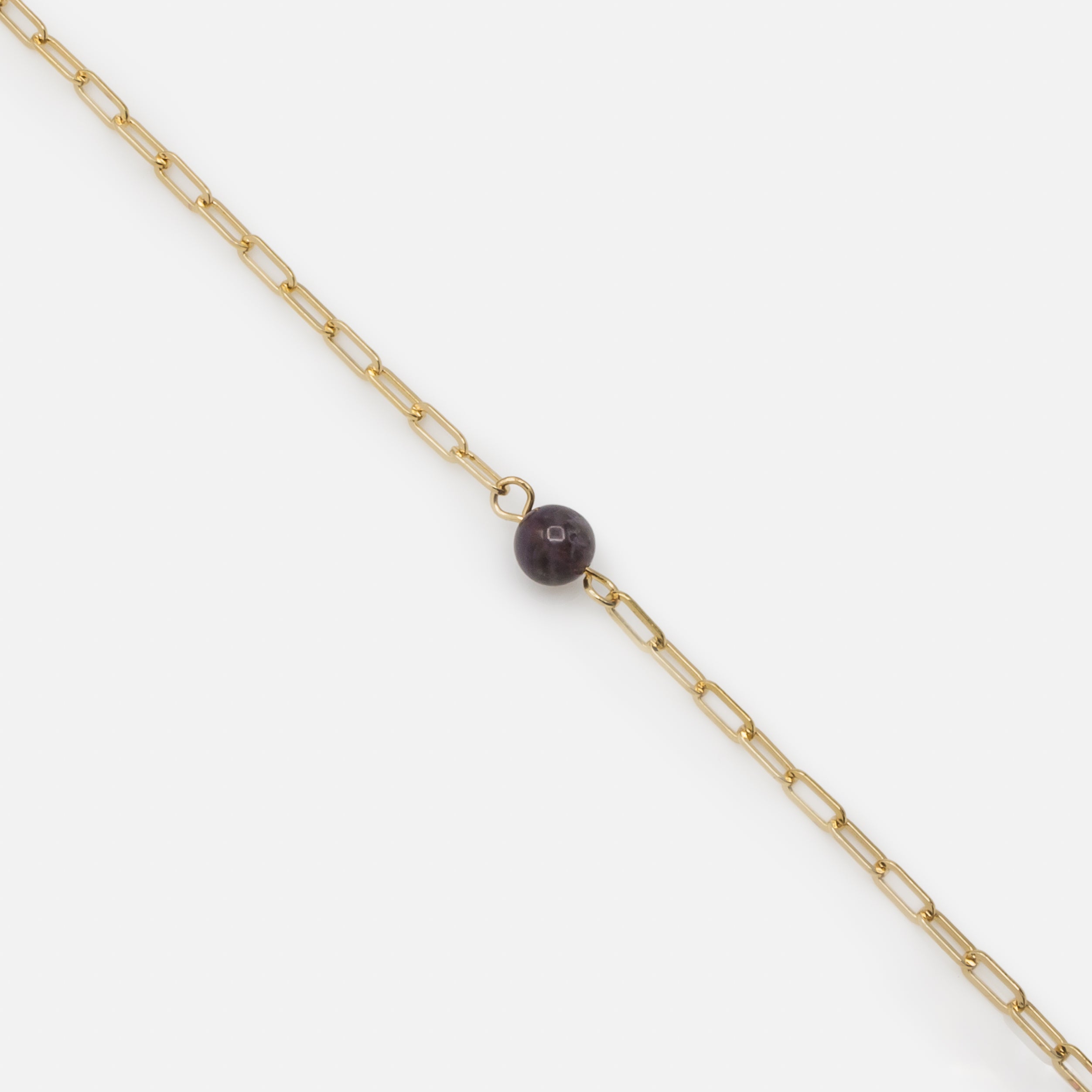 Bracelet doré à mailles trombone avec pierre sphérique mauve