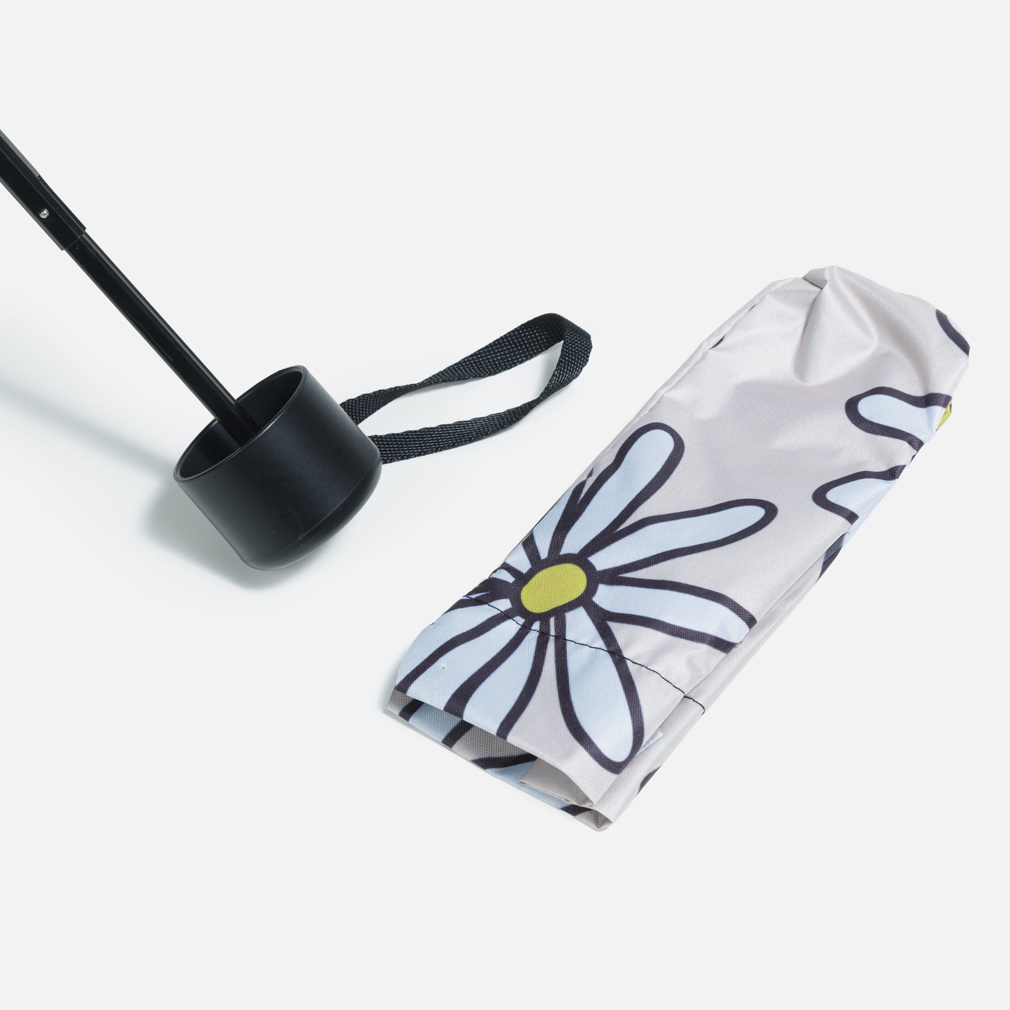 Beige umbrella with daisies and storage bag