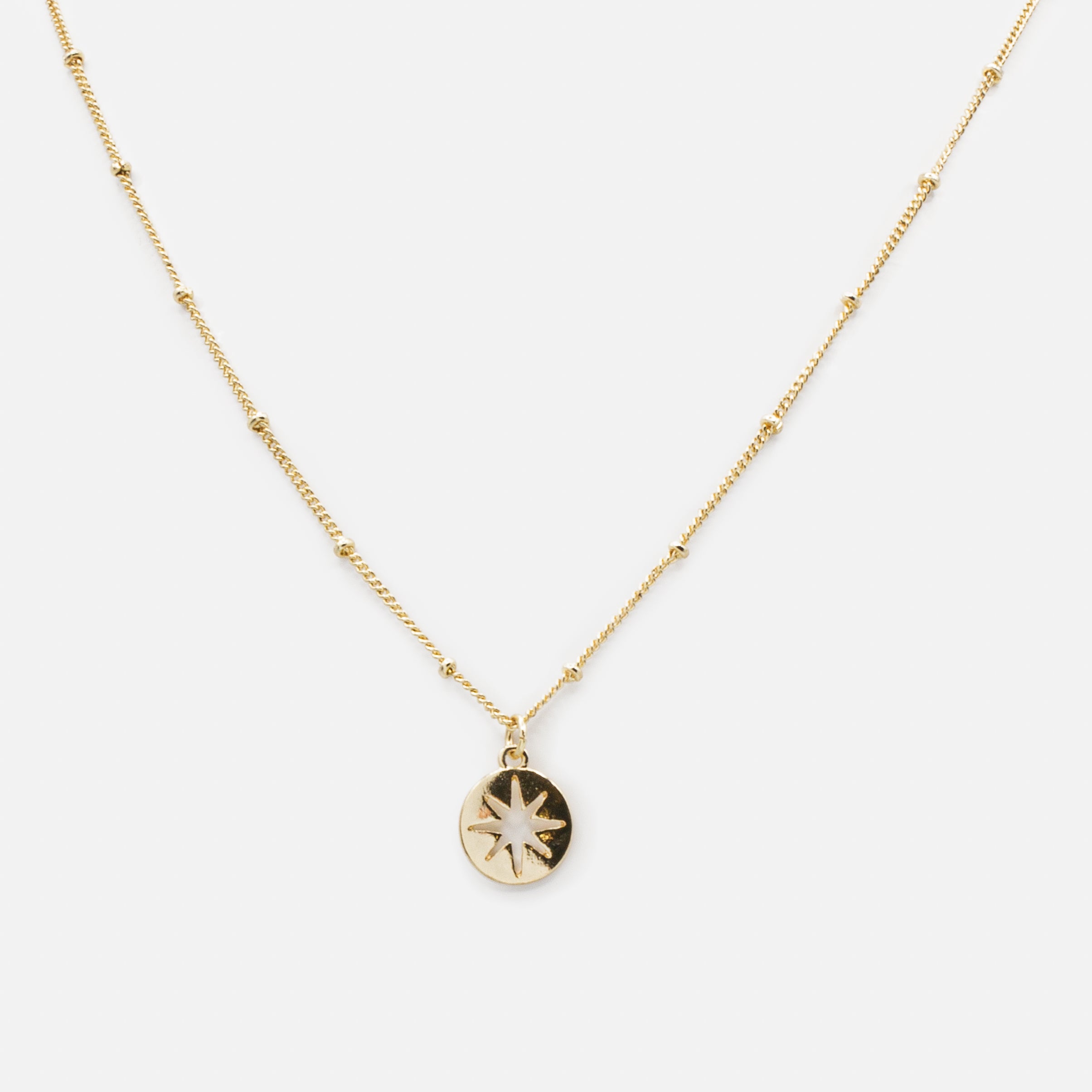 Gold empty star charm necklace