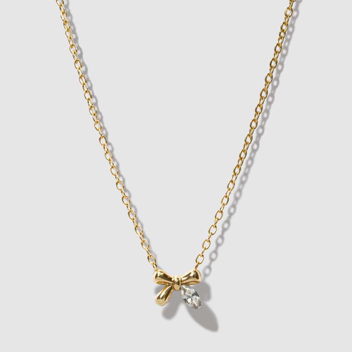 Mini collier doré, pendentif nœud et pierre en cristal en acier inoxydable