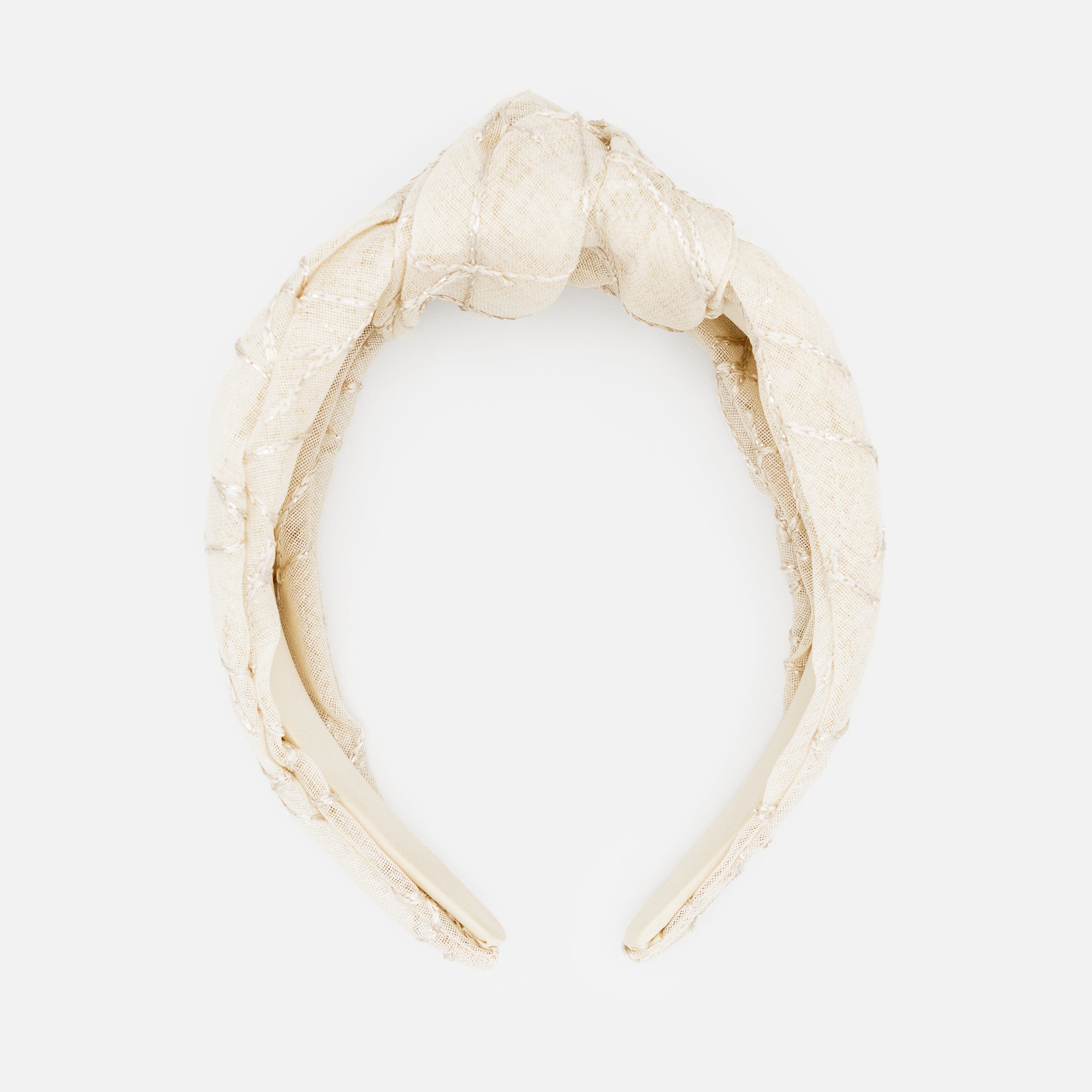 Beige headband with knot and linear embroidery