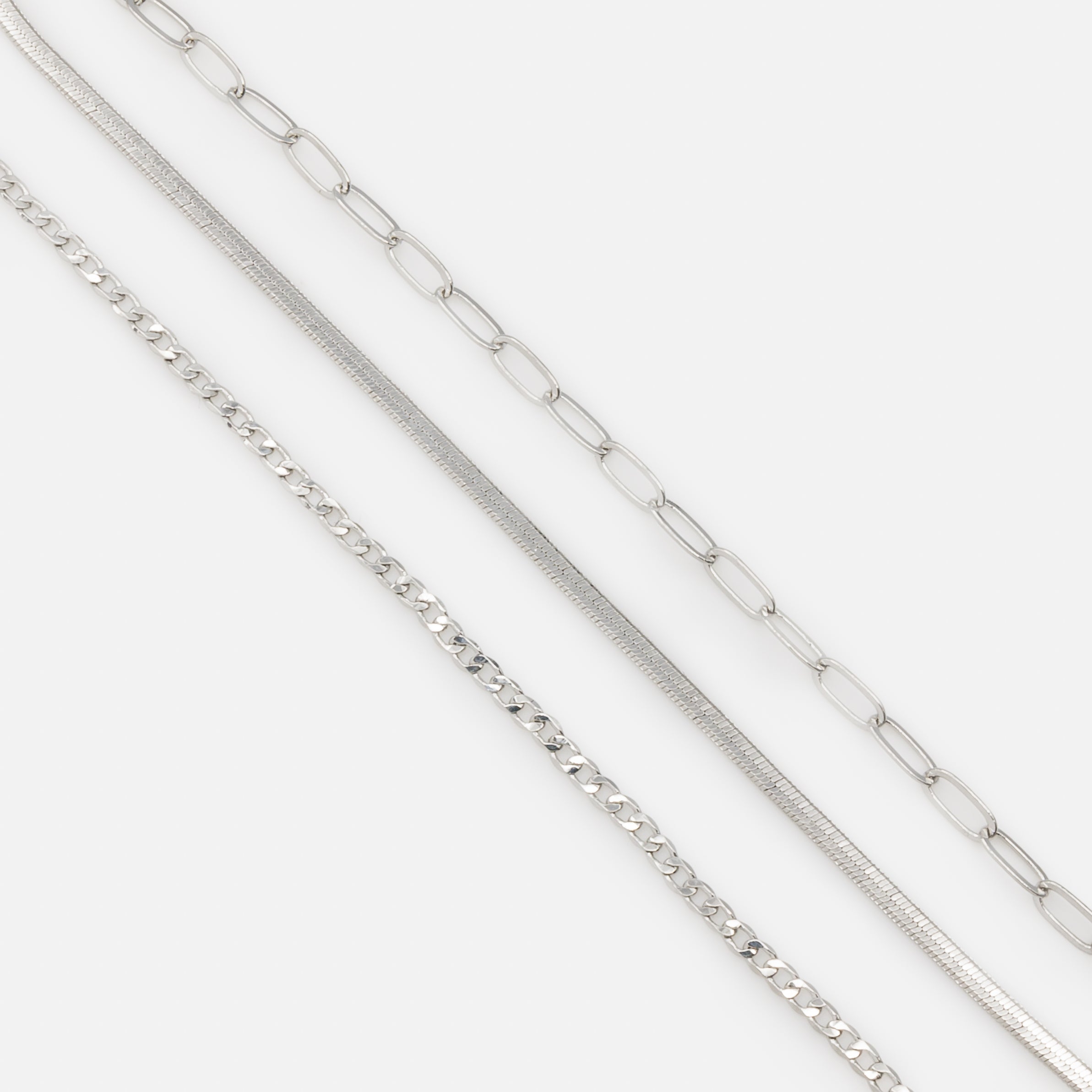 Set of three silver bracelets with delicate links