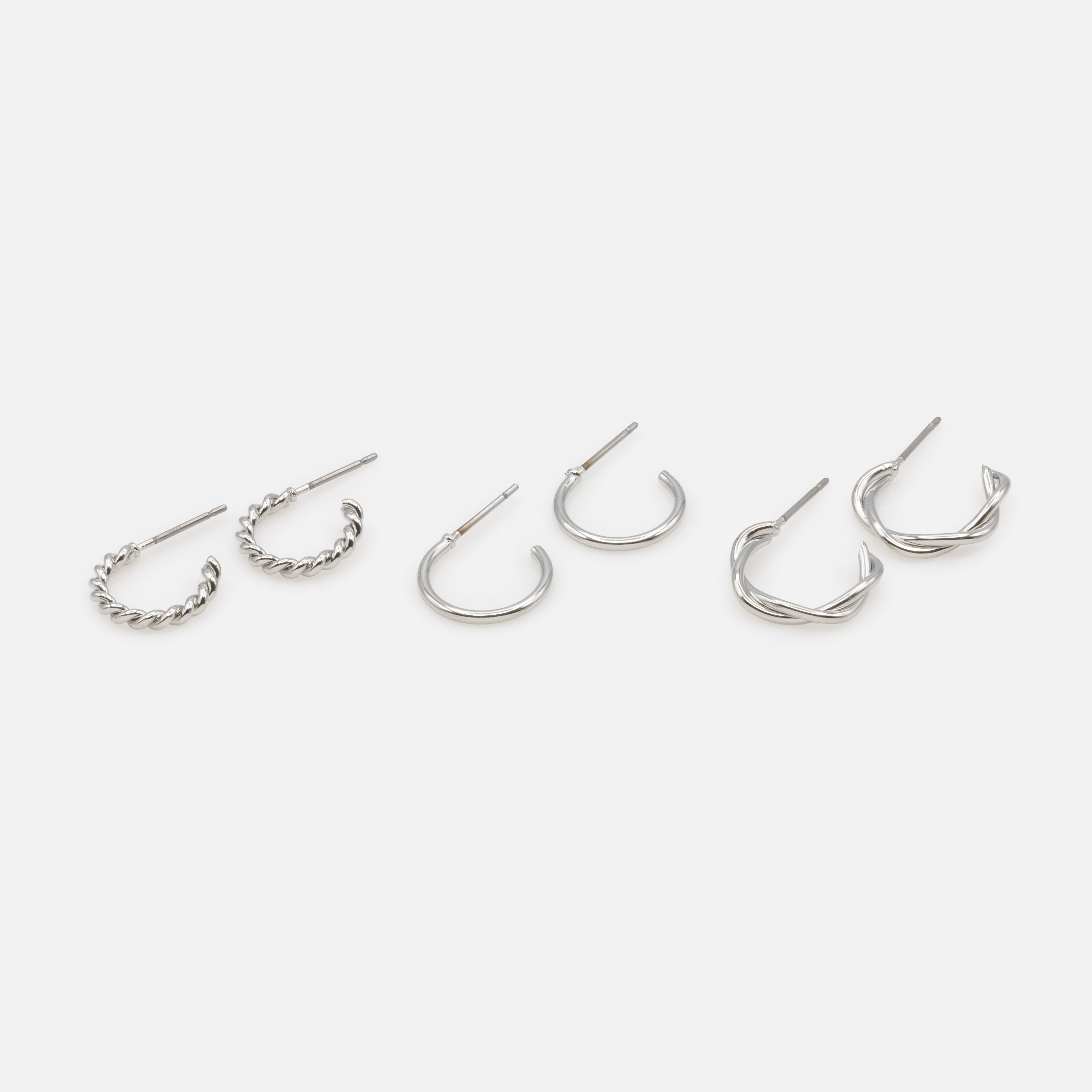 Trio de boucles d'oreilles anneaux argentés simples et torsadés