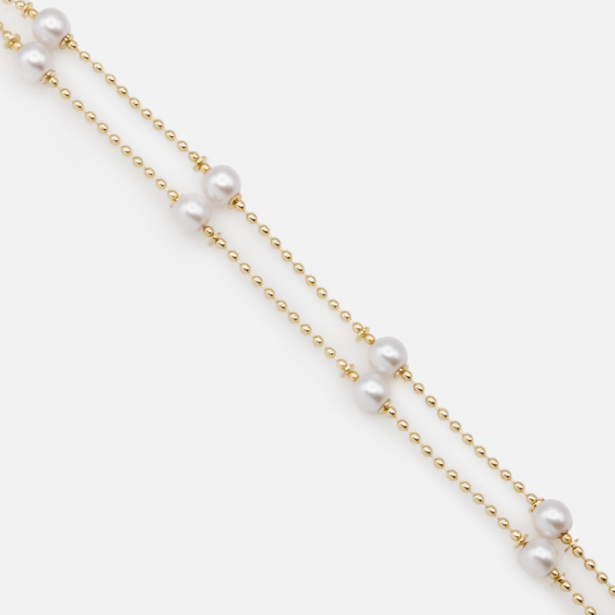 Double chain bracelet with fine gold beads and round pearls