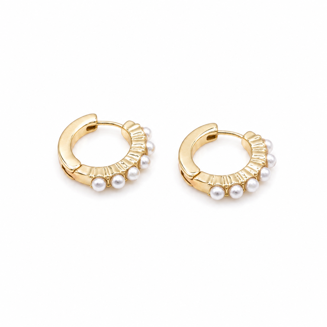 Textured gold huggie earrings with inlaid pearls