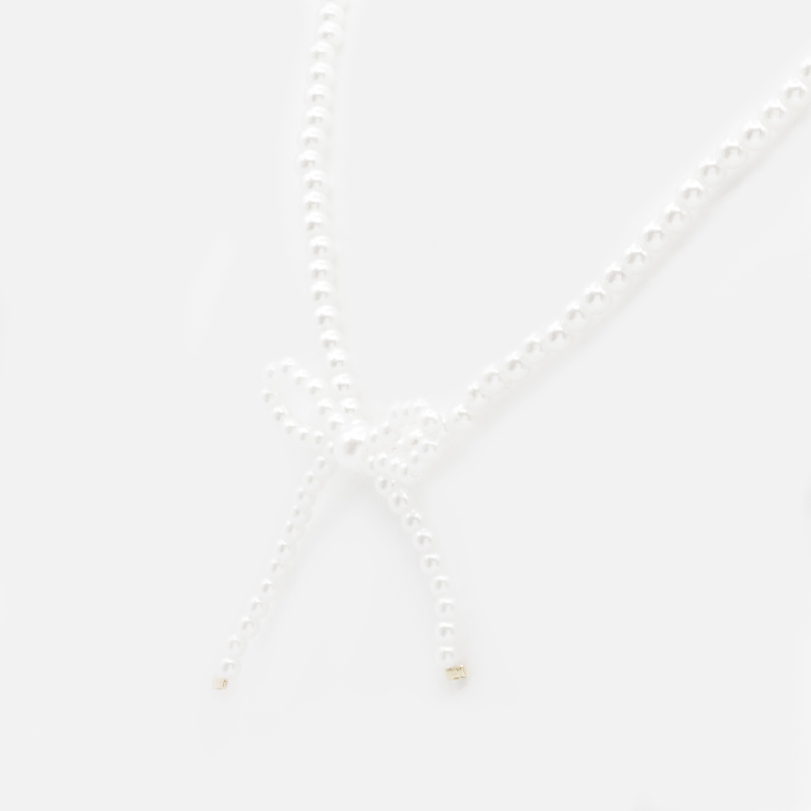 Collier de perles avec boucle latérale