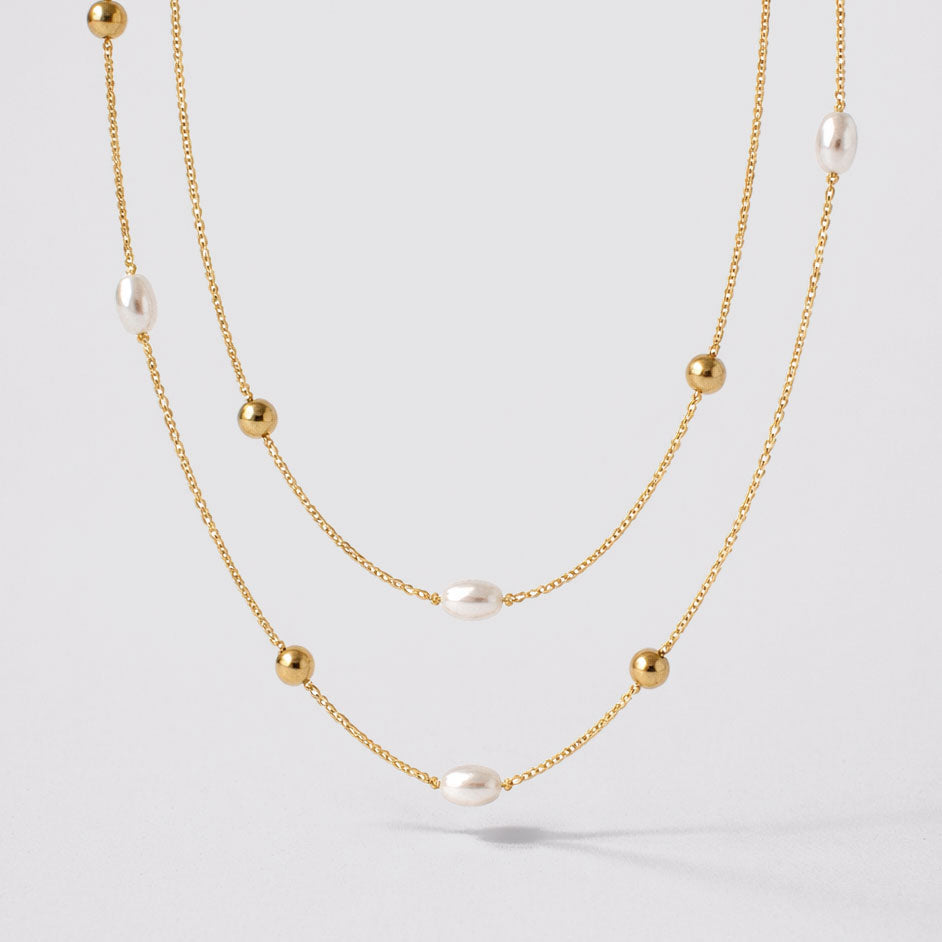 Collier double rang doré à perles et billes
