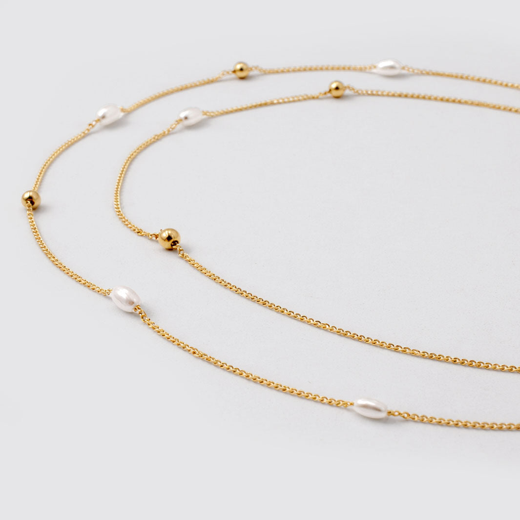 Collier double rang doré à perles et billes