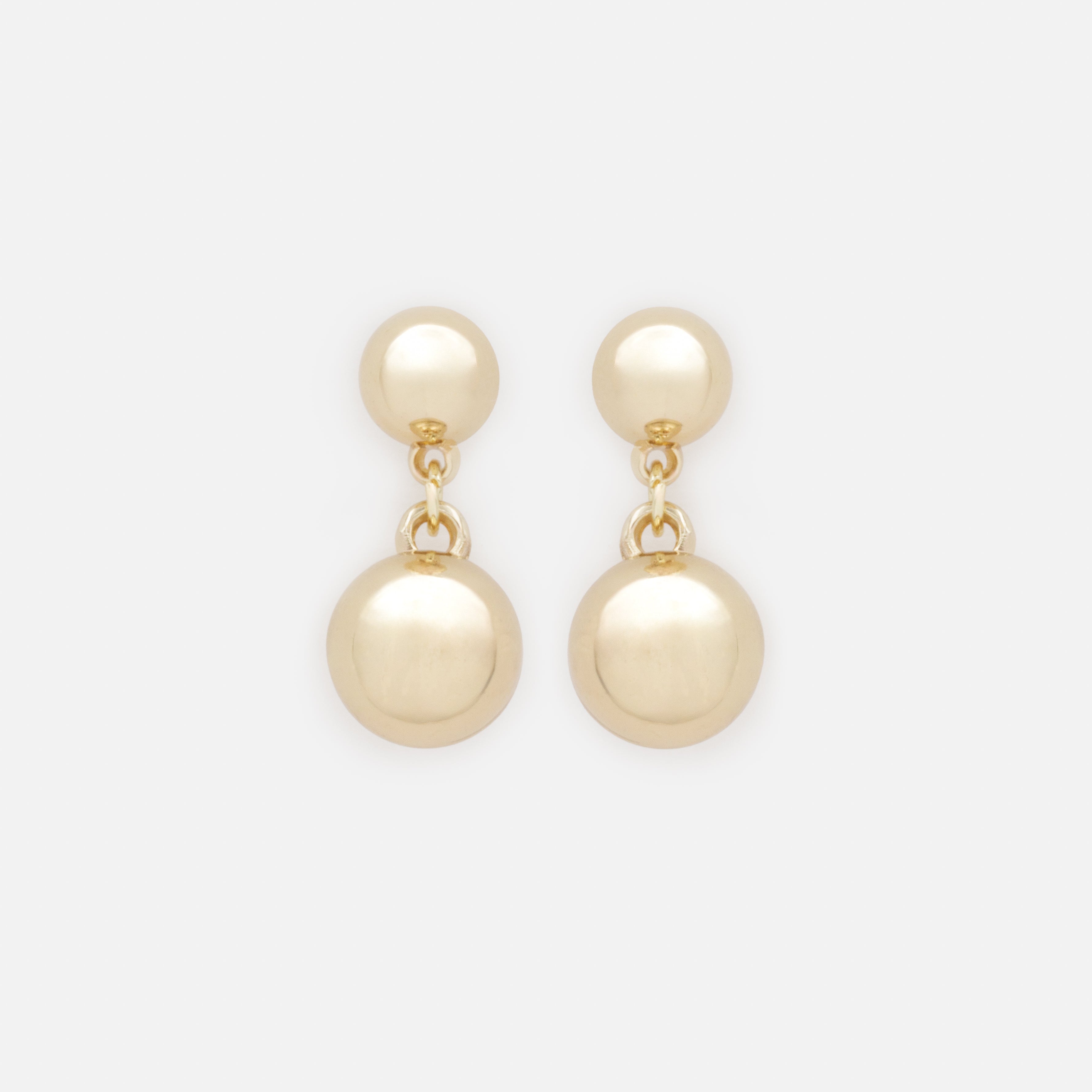 Gold dangling sphere earrings