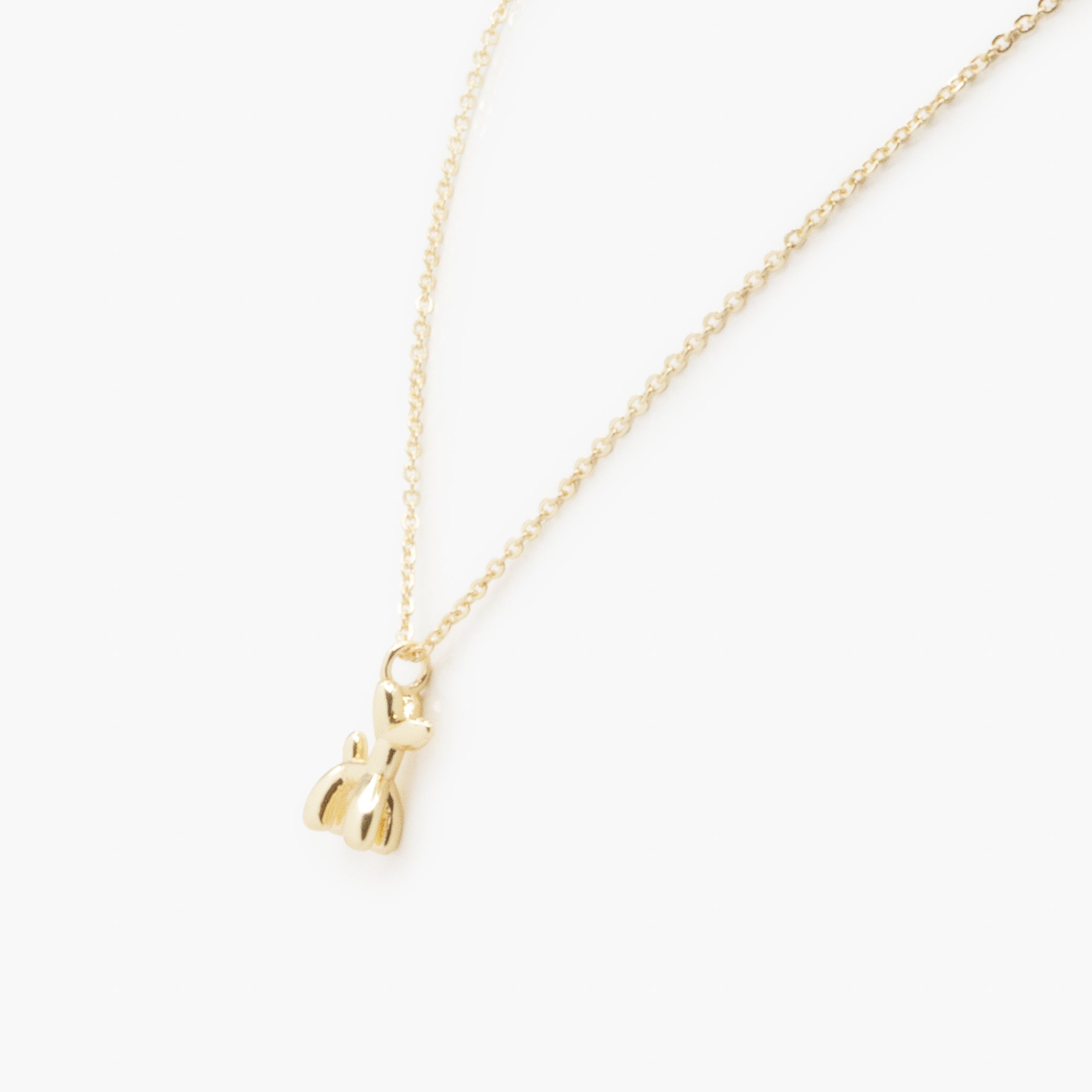 Collier doré breloque petit chien