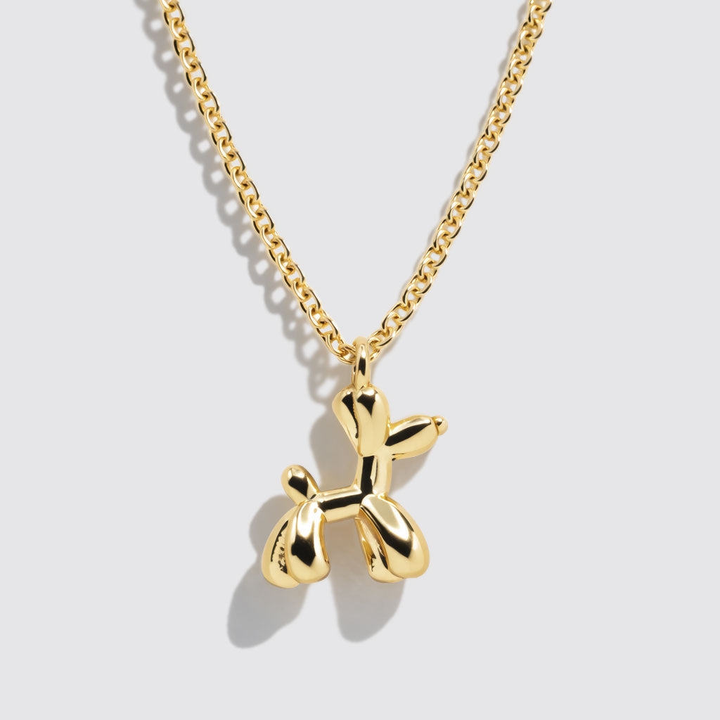 Collier doré à pendentif charm chien ballon