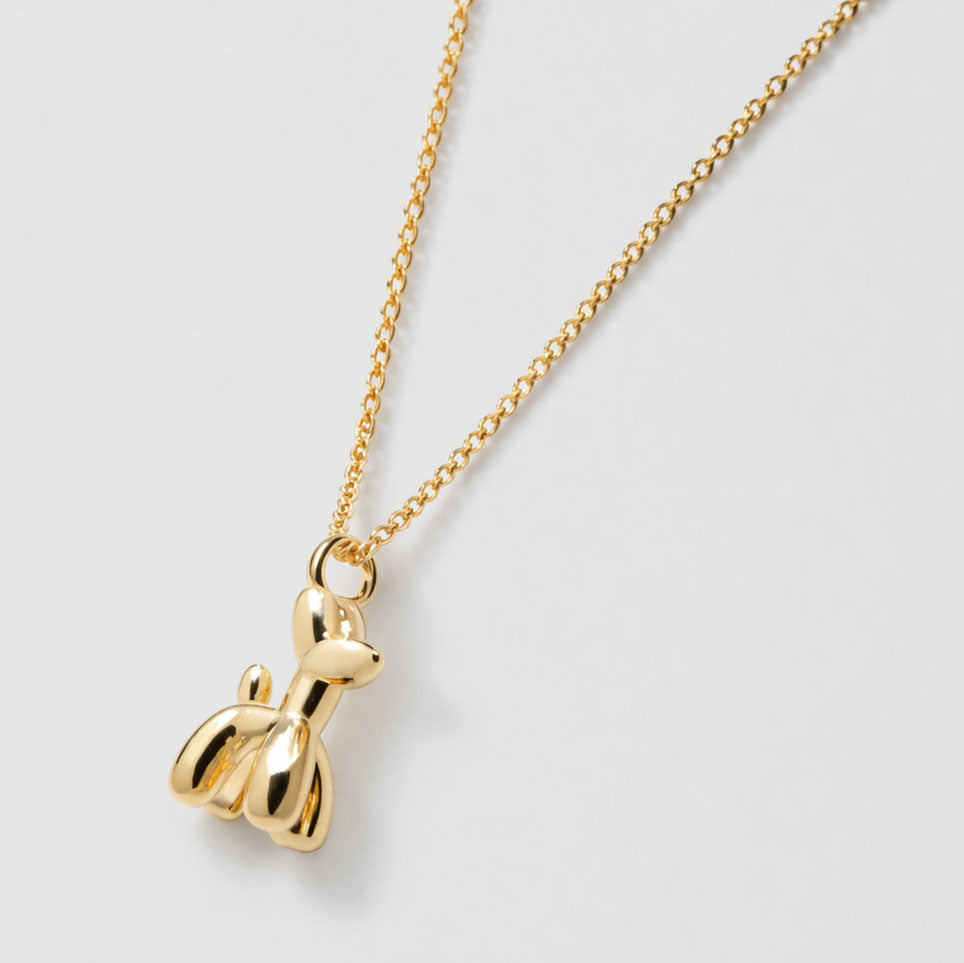 Collier doré à pendentif charm chien ballon