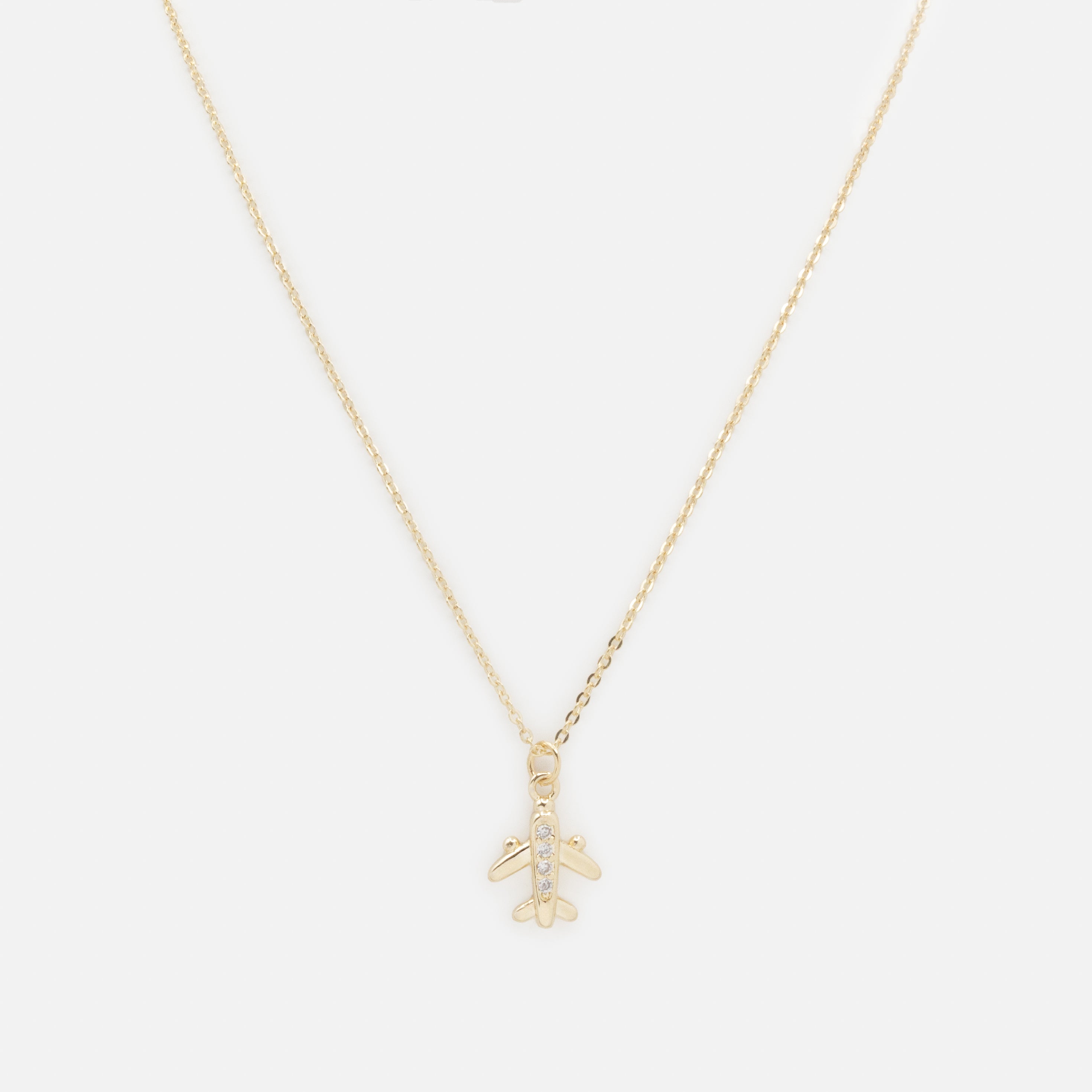 Collier doré breloque petit avion avec zircons cubiques