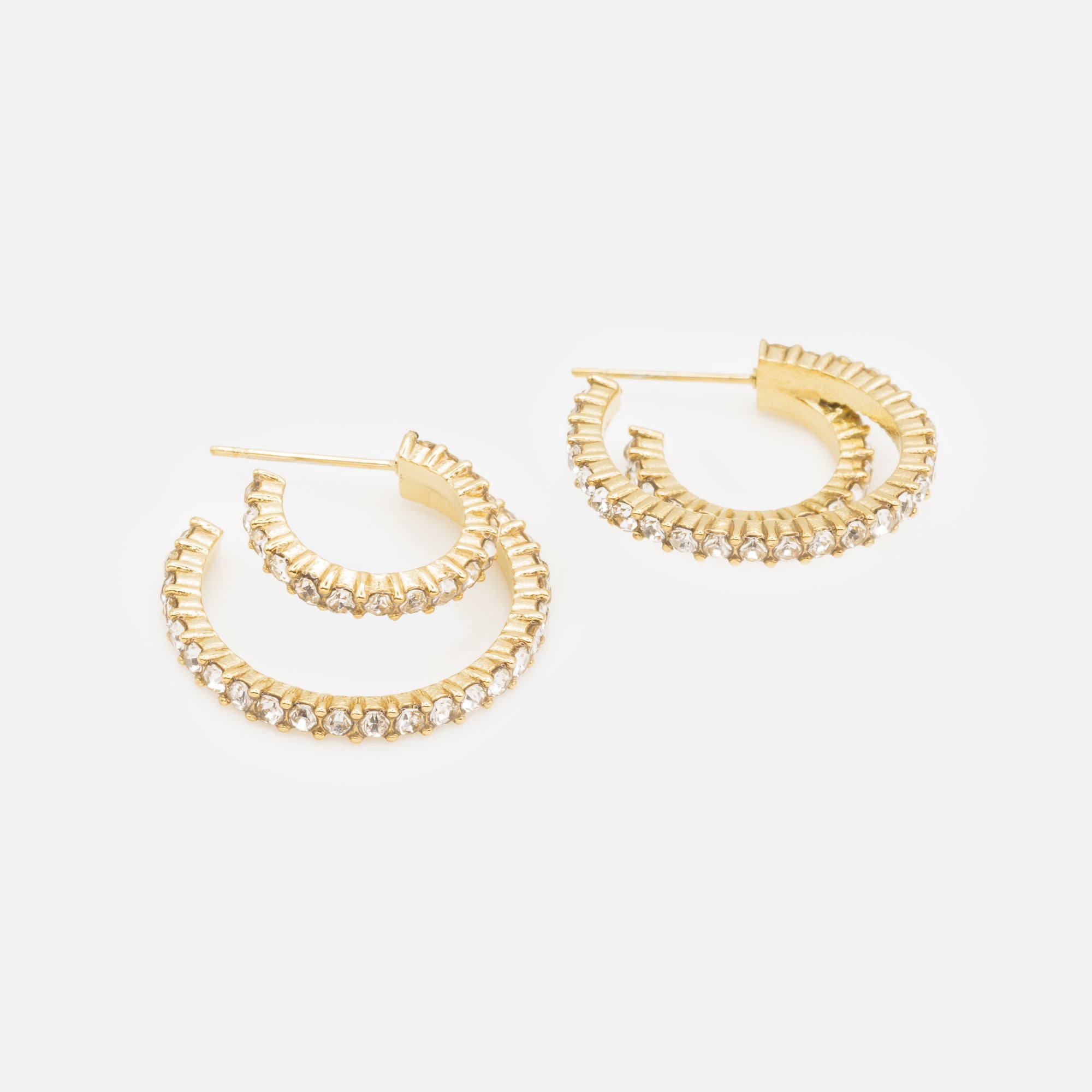 Double gold hoop earrings covered with cubic zirconia in stainless steel