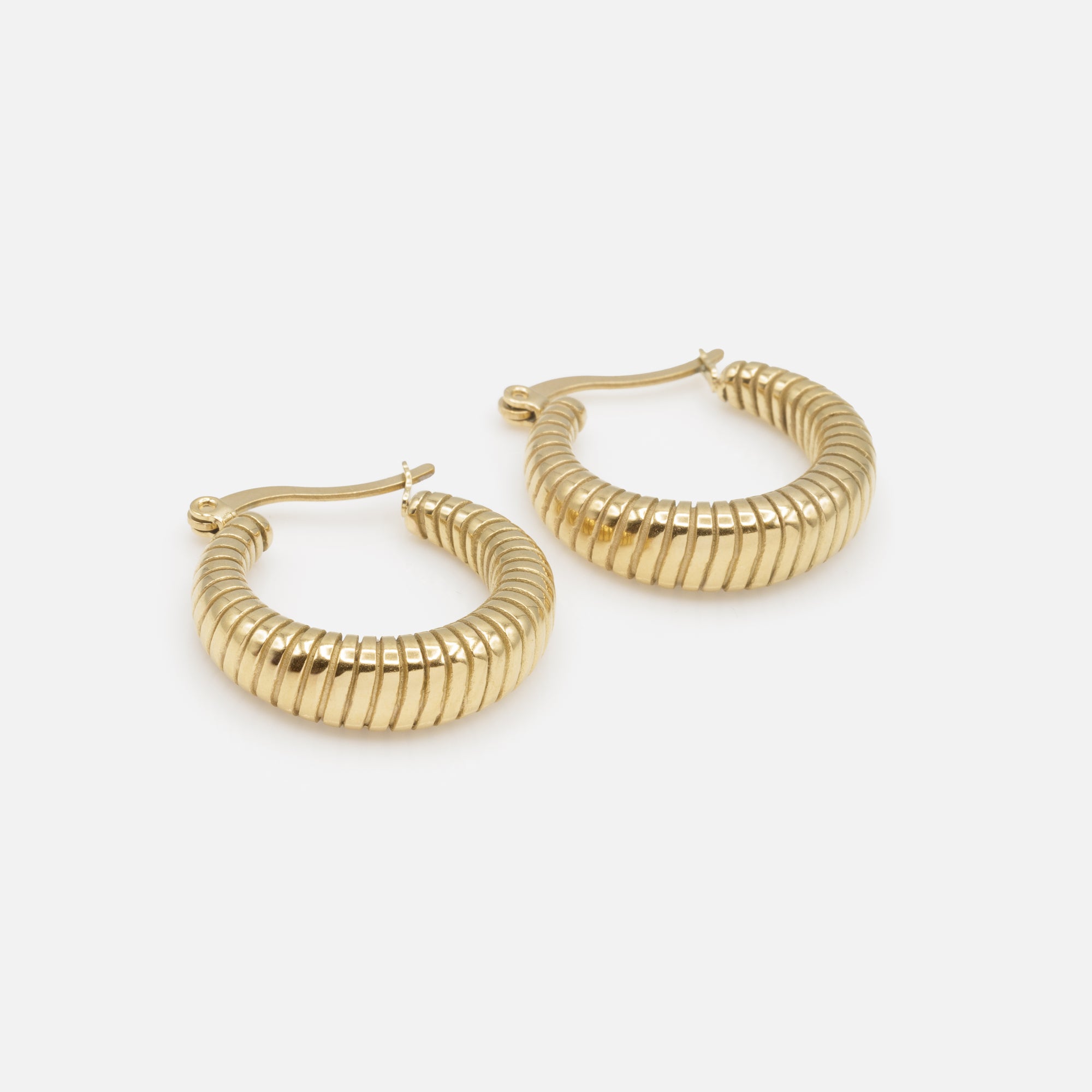 Wide gold hoop earrings with grooves in stainless steel