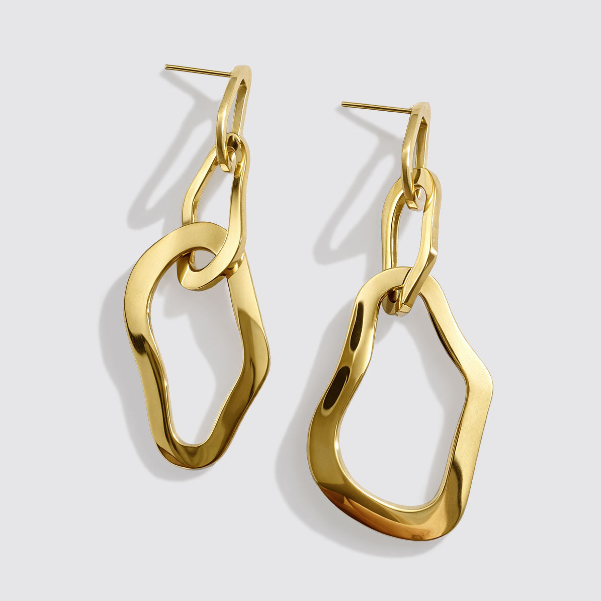 Boucles d'oreilles pendantes triple anneaux organiques dorés en acier inoxydable