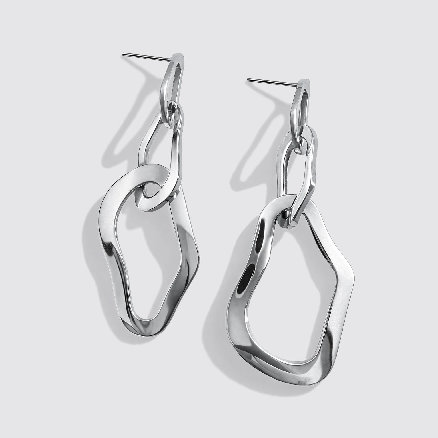 Boucles d'oreilles pendantes triple anneaux organiques argentées en acier inoxydable