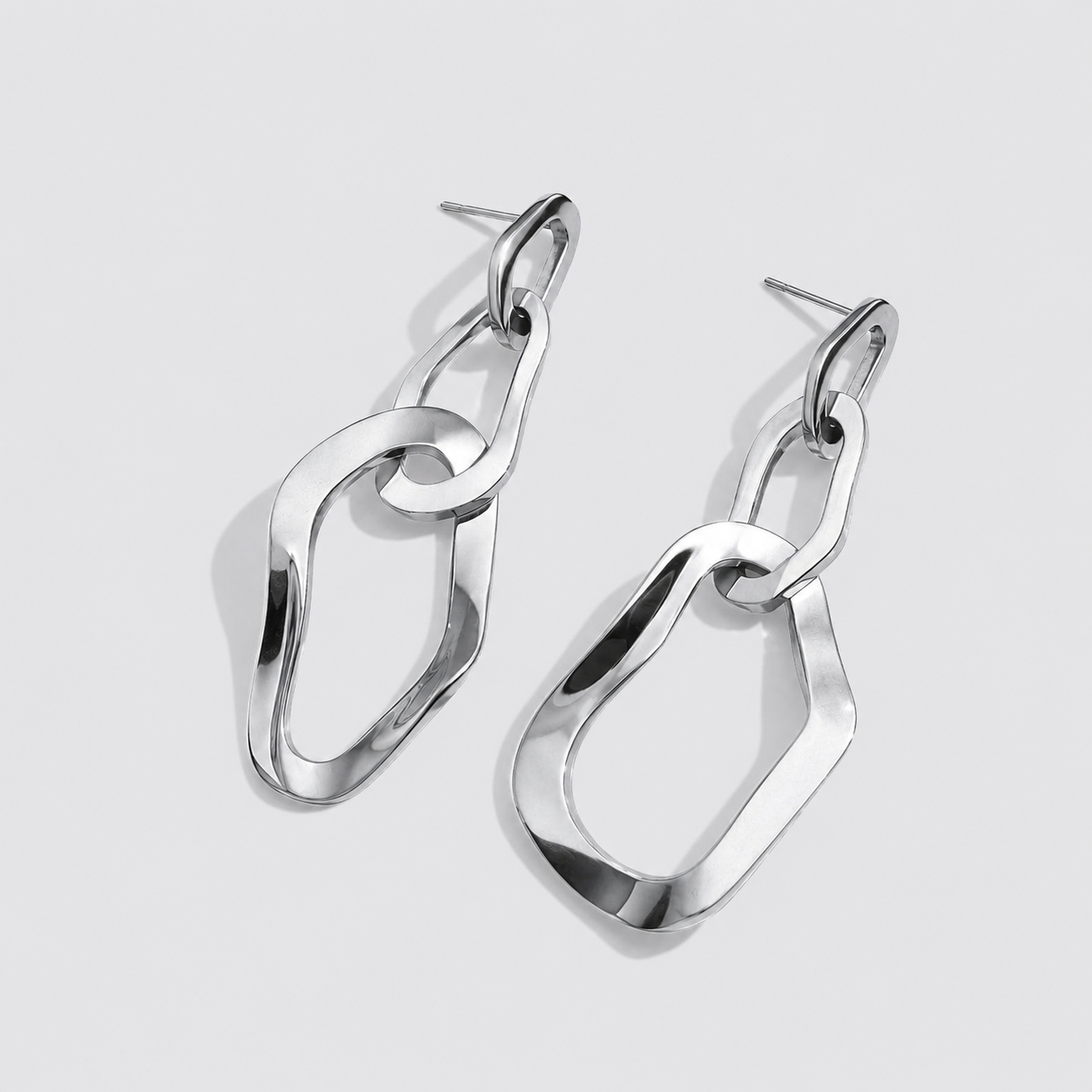 Boucles d'oreilles pendantes triple anneaux organiques argentées en acier inoxydable