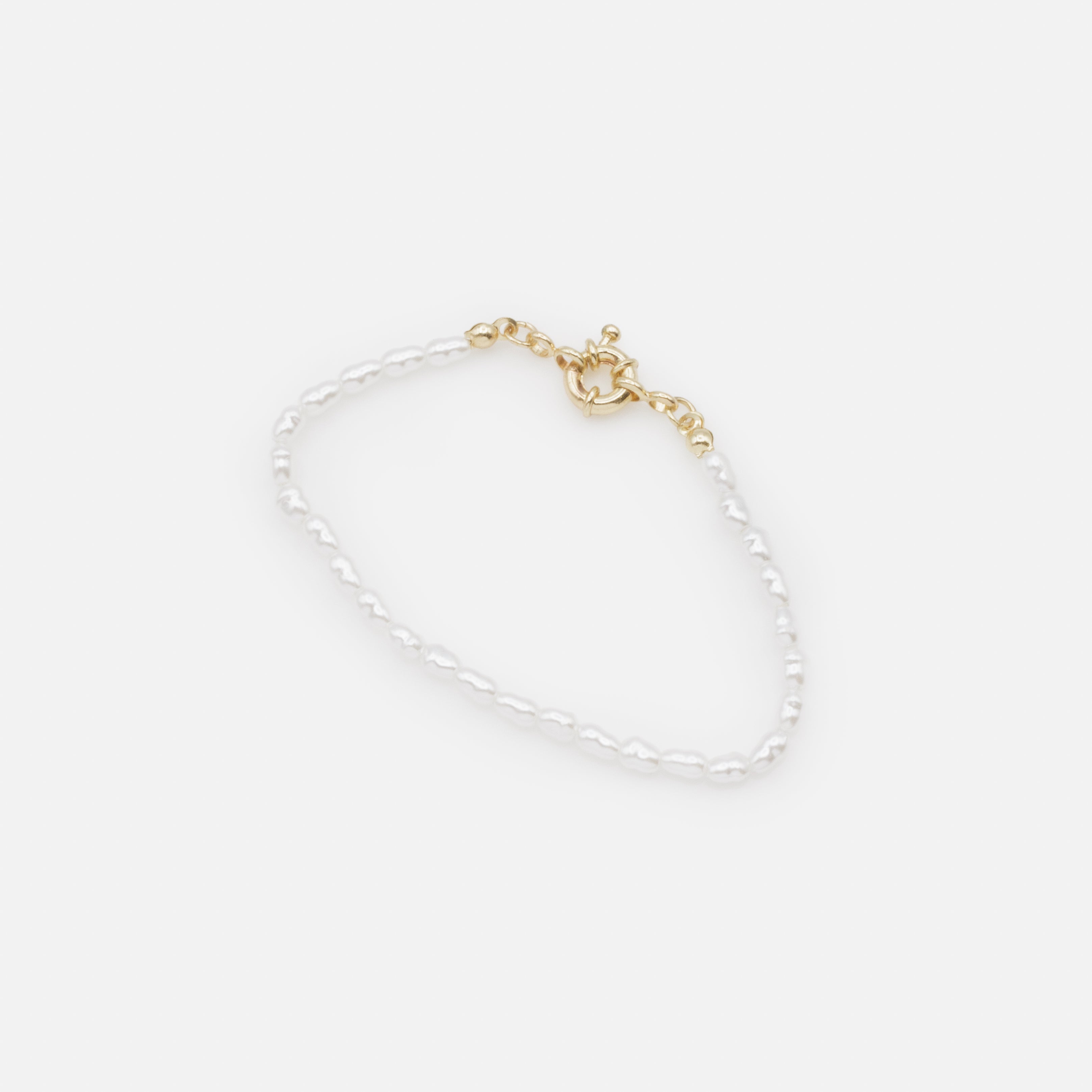 Ensemble trois bracelets dorés perles et billes