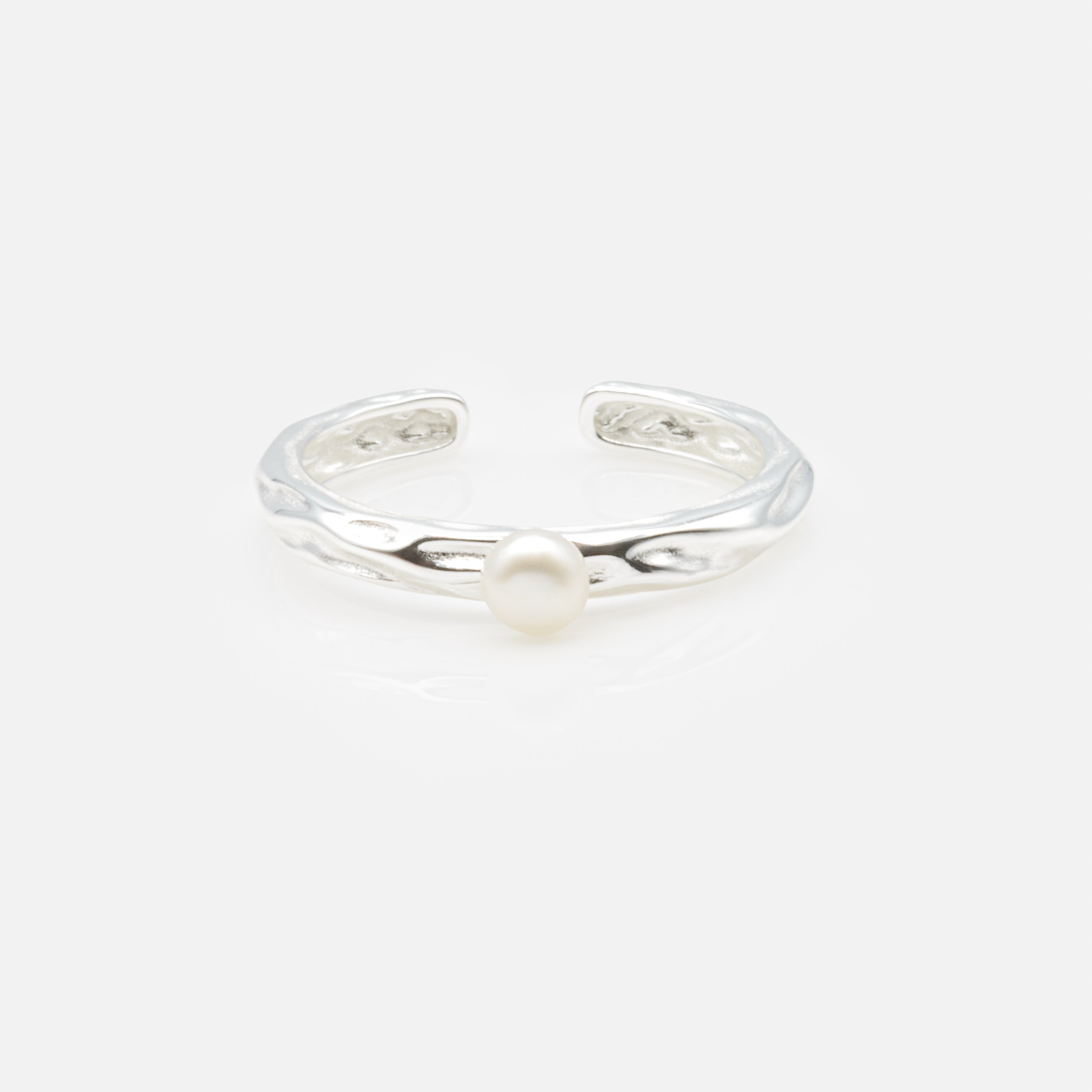 Textured open ring with solitaire pearl in sterling silver