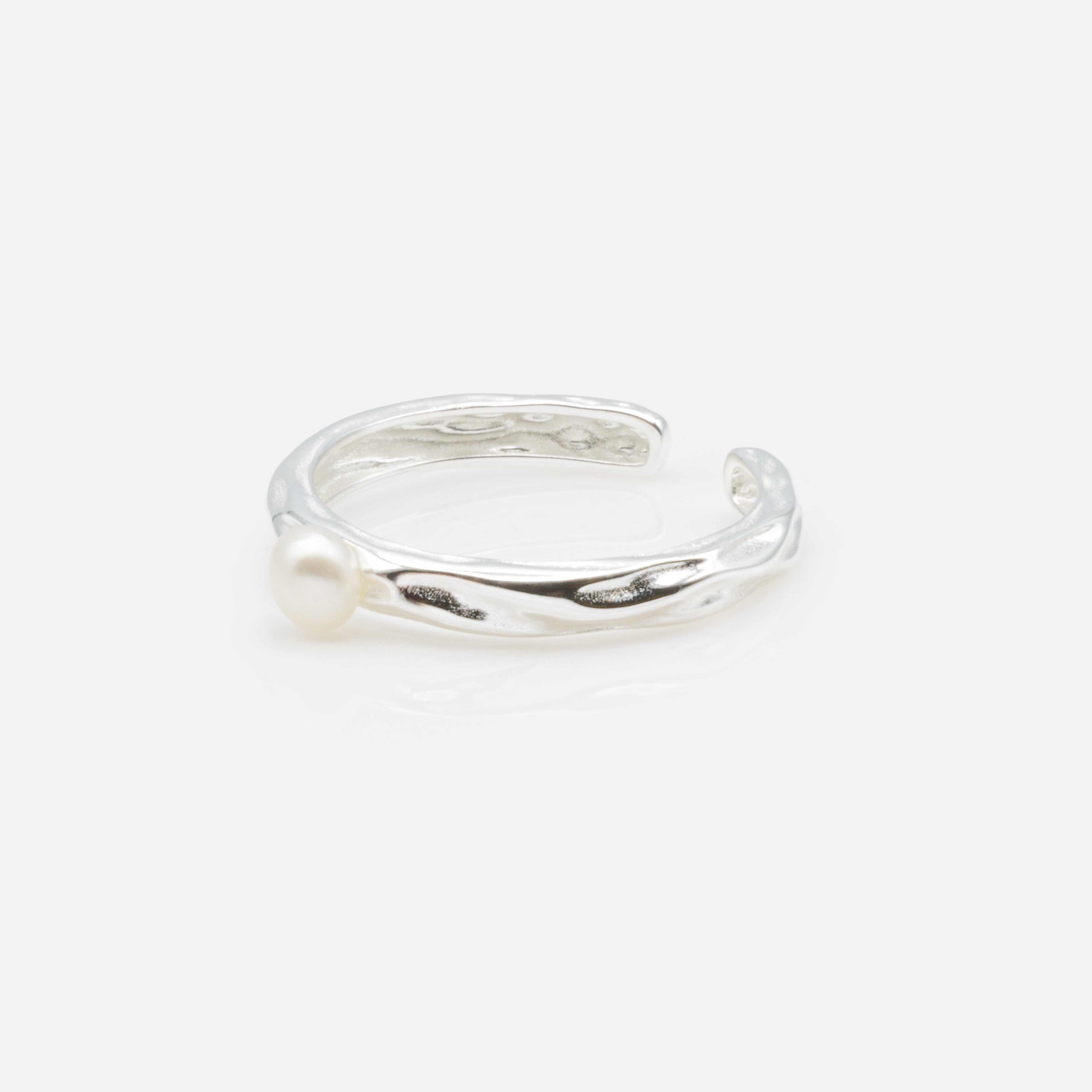 Textured open ring with solitaire pearl in sterling silver