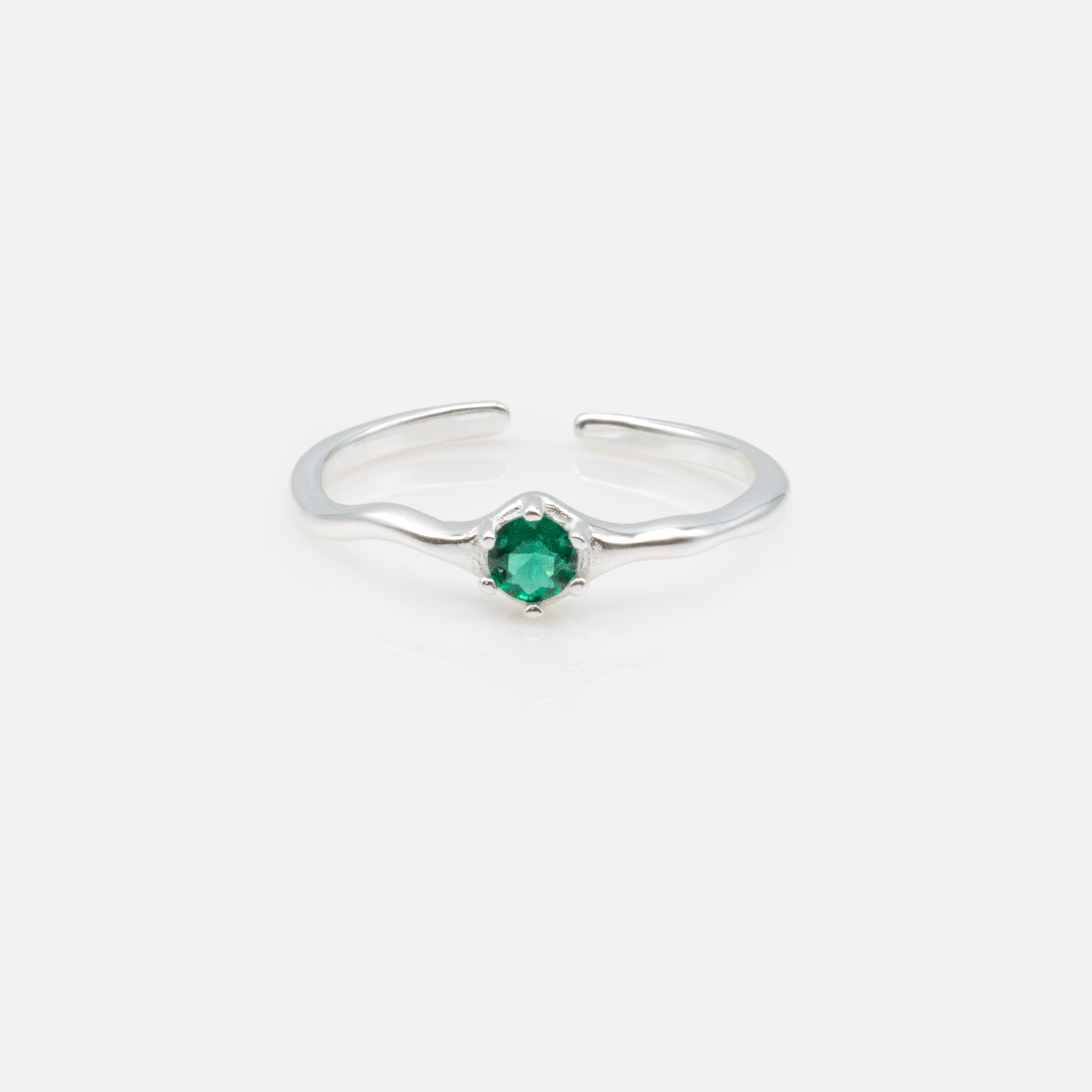 Open ring with emerald stone in sterling silver