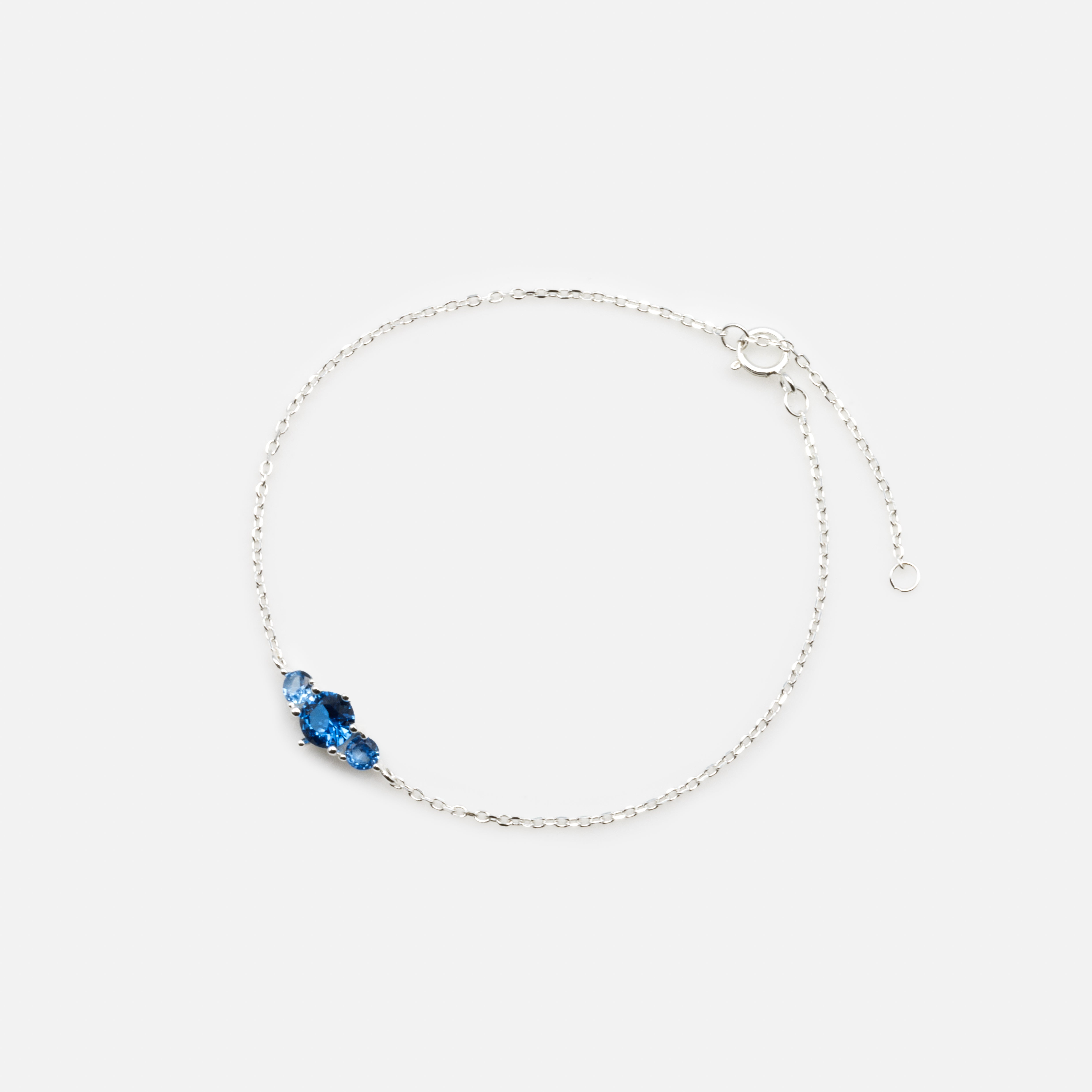 Delicate bracelet with trio of blue cubic zirconia in sterling silver