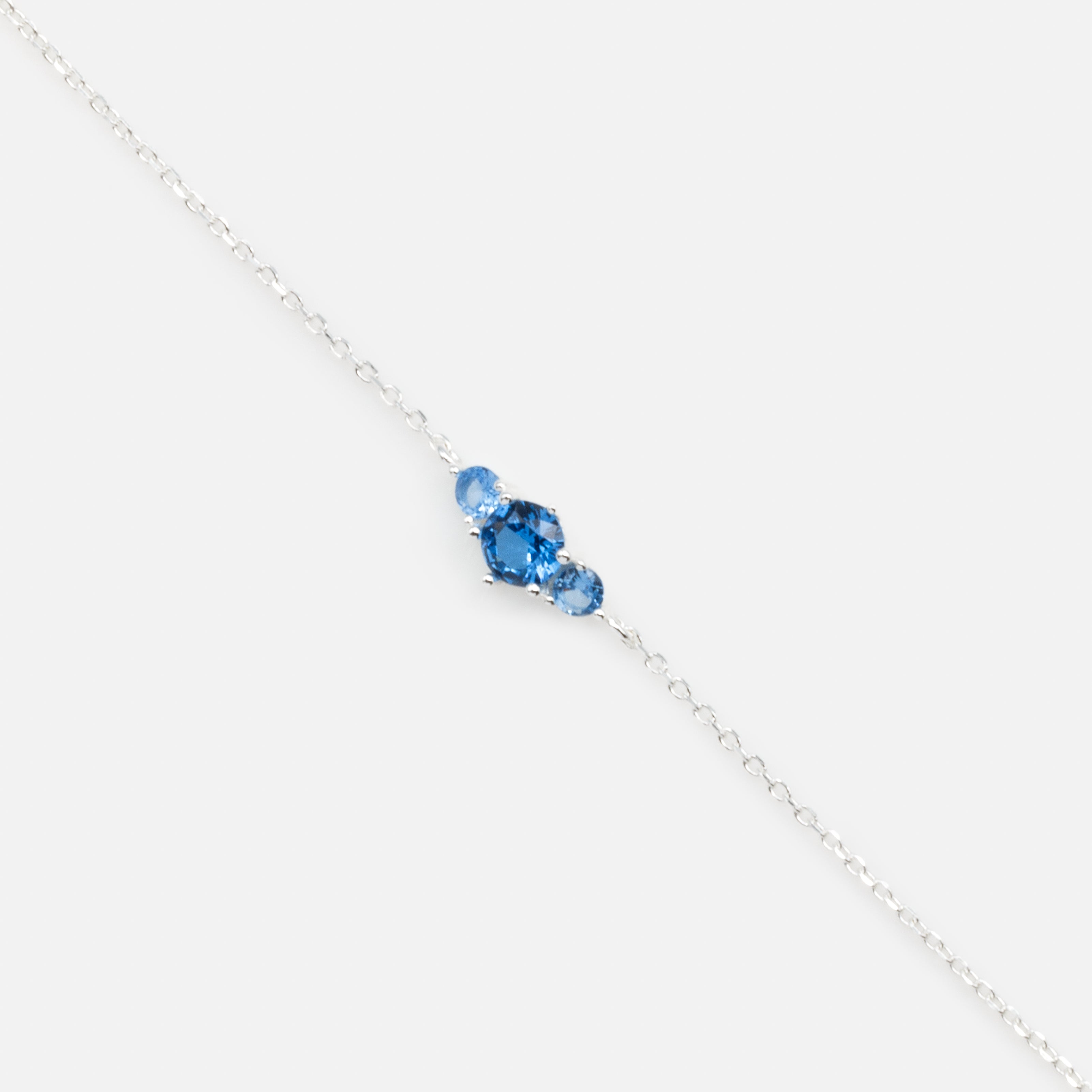Delicate bracelet with trio of blue cubic zirconia in sterling silver